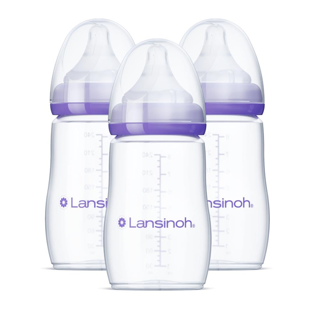Showcases the product clearly, highlighting the set of three Lansinoh baby bottles with purple accents. Displays multiple identical bottles to indicate that this is a multi-pack offering, giving…