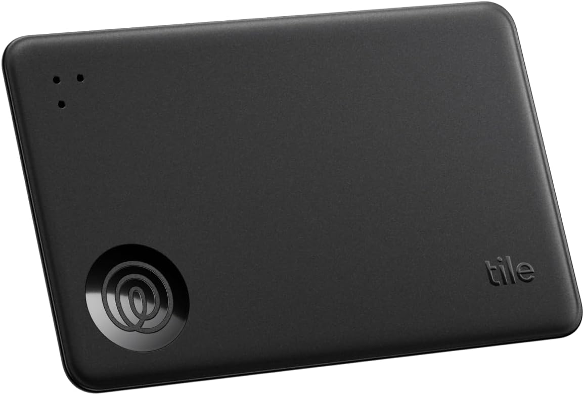 Showcases the sleek, compact design of the Tile tracking device against a plain background.