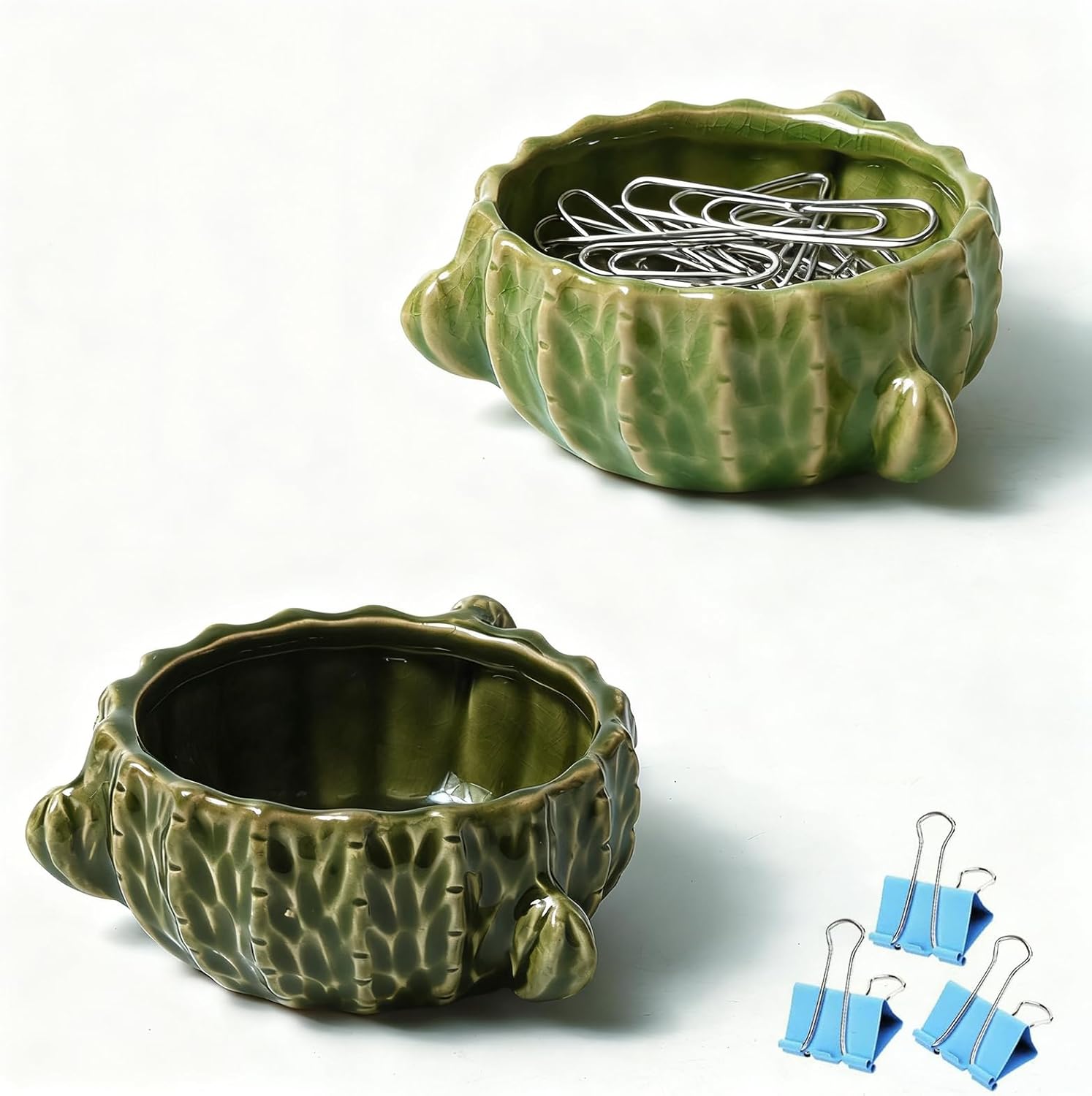 Showcases the cactus-shaped ceramic container and its functionality as a paperclip holder, emphasizing its decorative and practical nature.