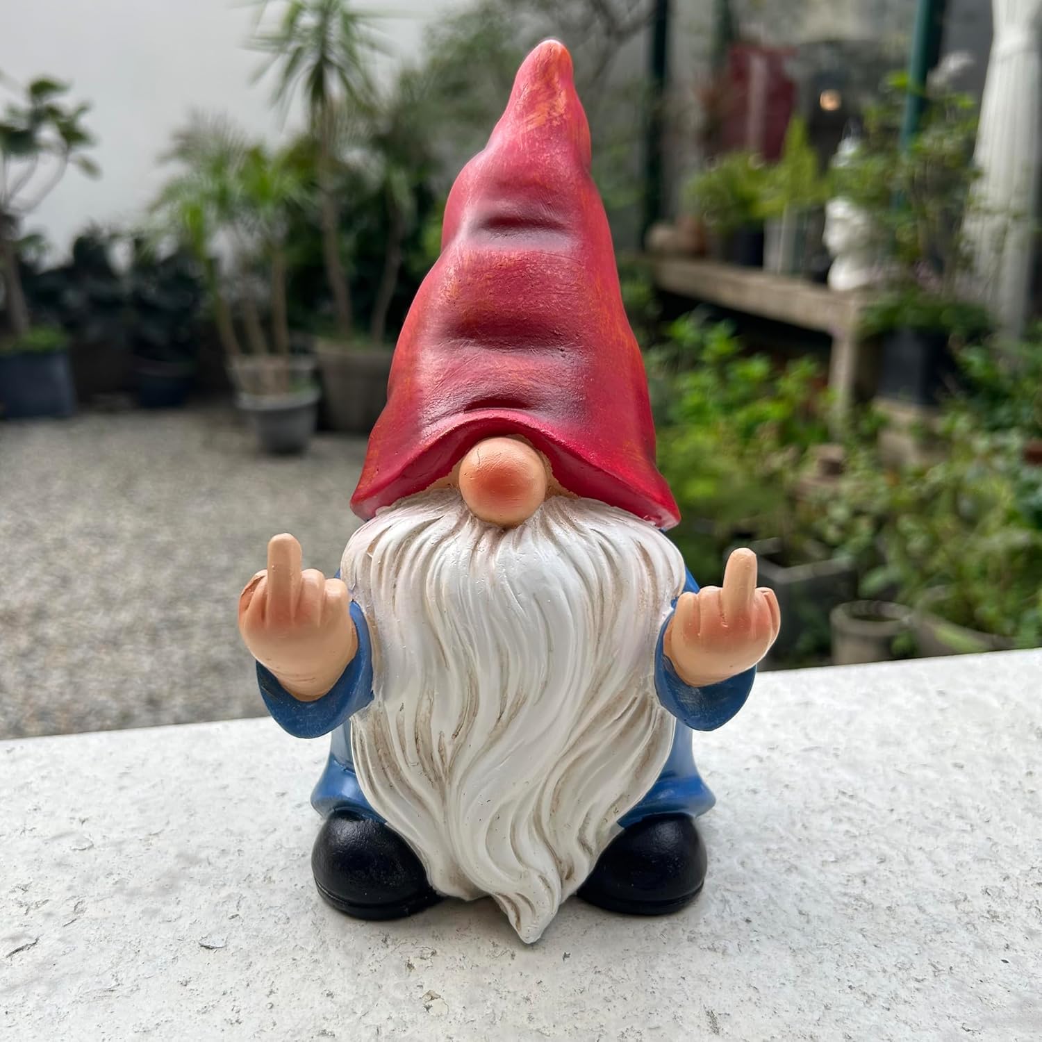 Showcases a quirky garden gnome product with a humorous gesture to appeal to customers looking for unique outdoor decor.