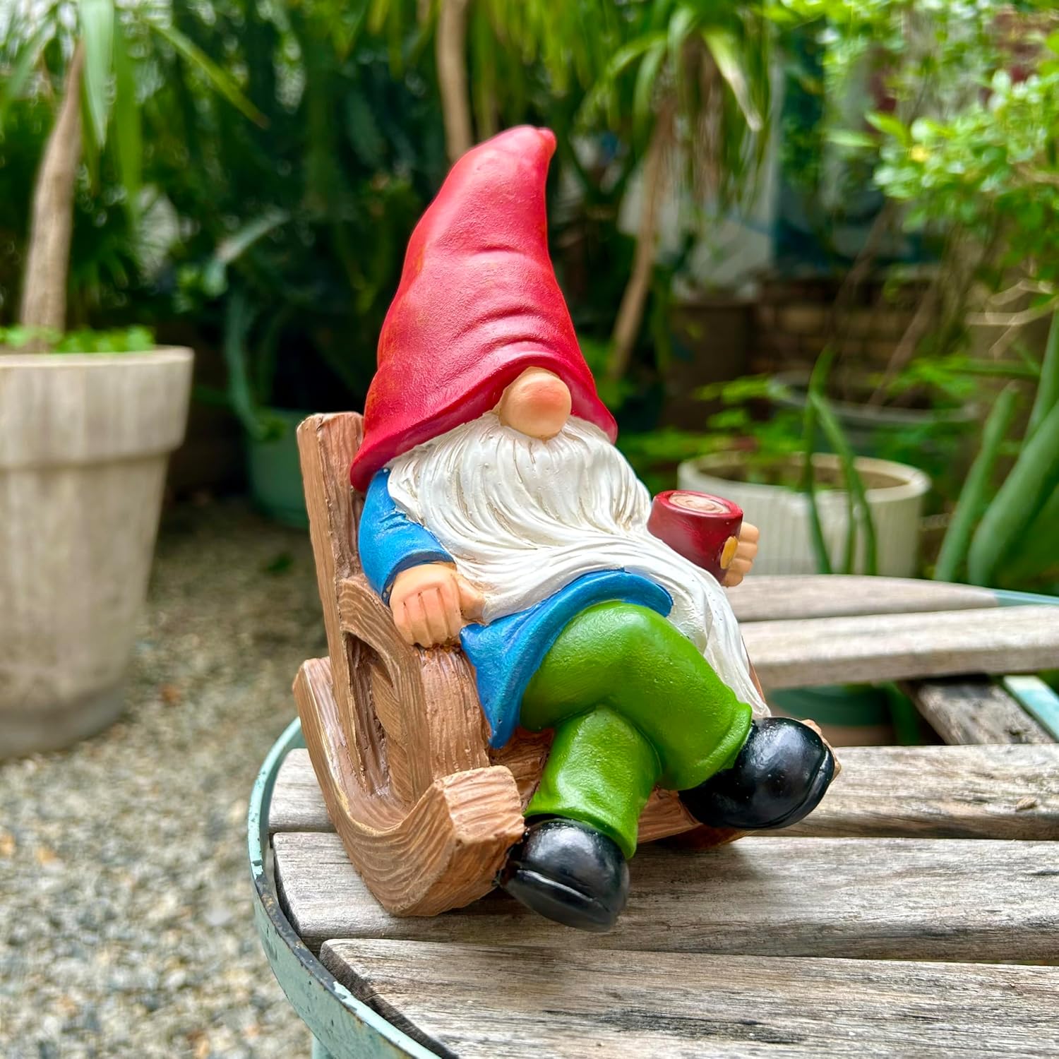 Shows the product in a natural garden setting to demonstrate its use as outdoor decoration.
