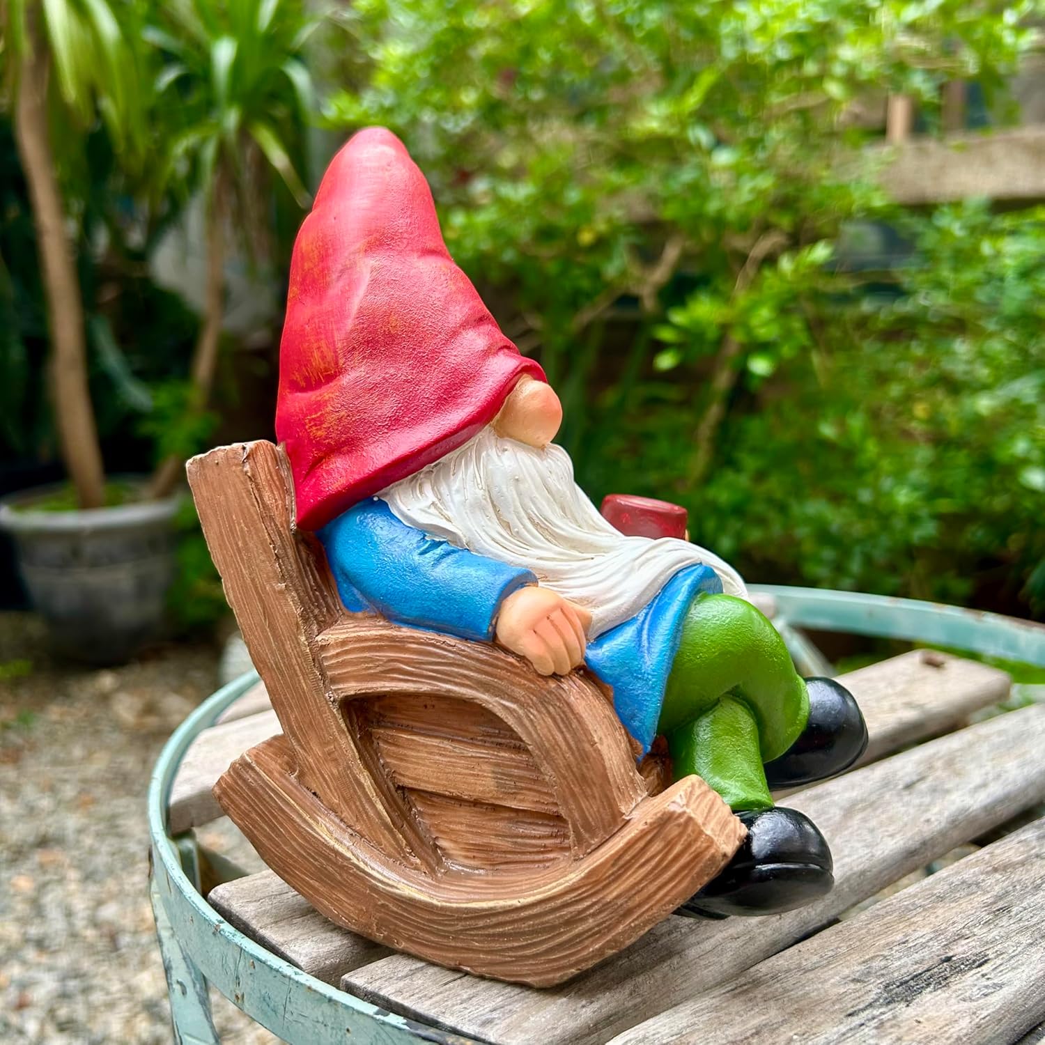 Shows the product in a natural garden setting to demonstrate how it can be used as outdoor decoration.
