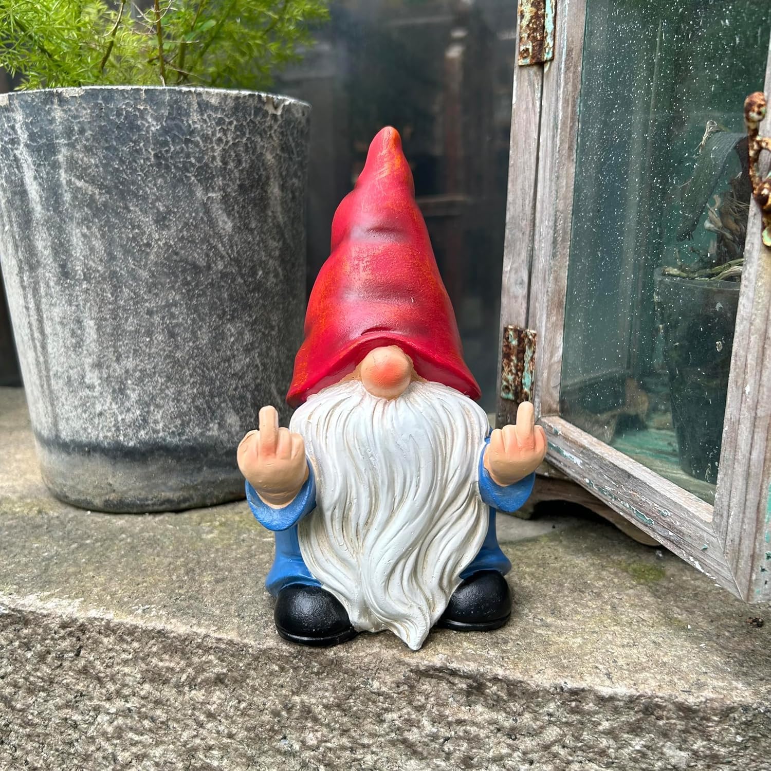 Shows the product in a realistic outdoor setting to demonstrate its use as a humorous garden decoration.