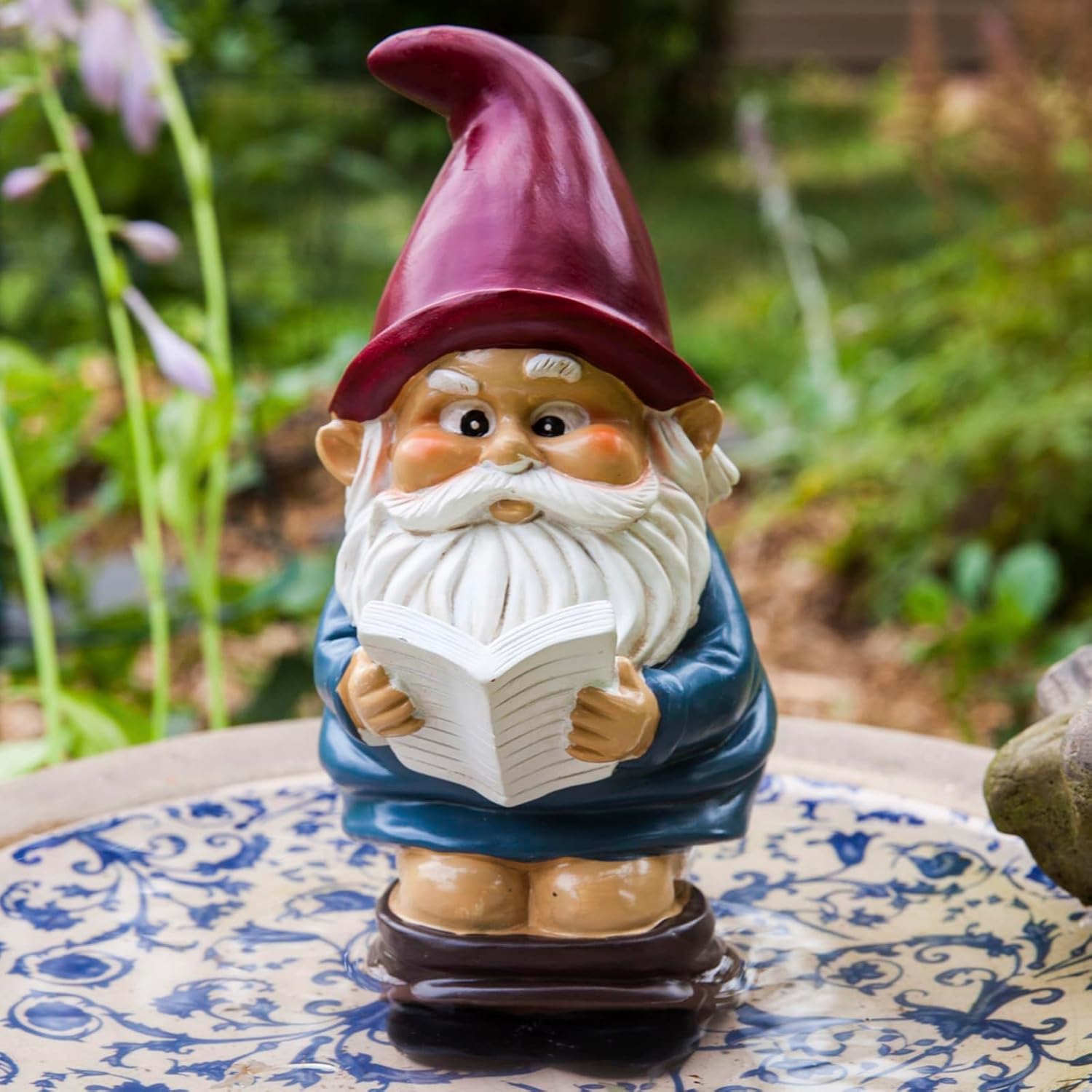 Shows the product in a realistic outdoor setting to demonstrate how it can be used as a decorative element in a garden.