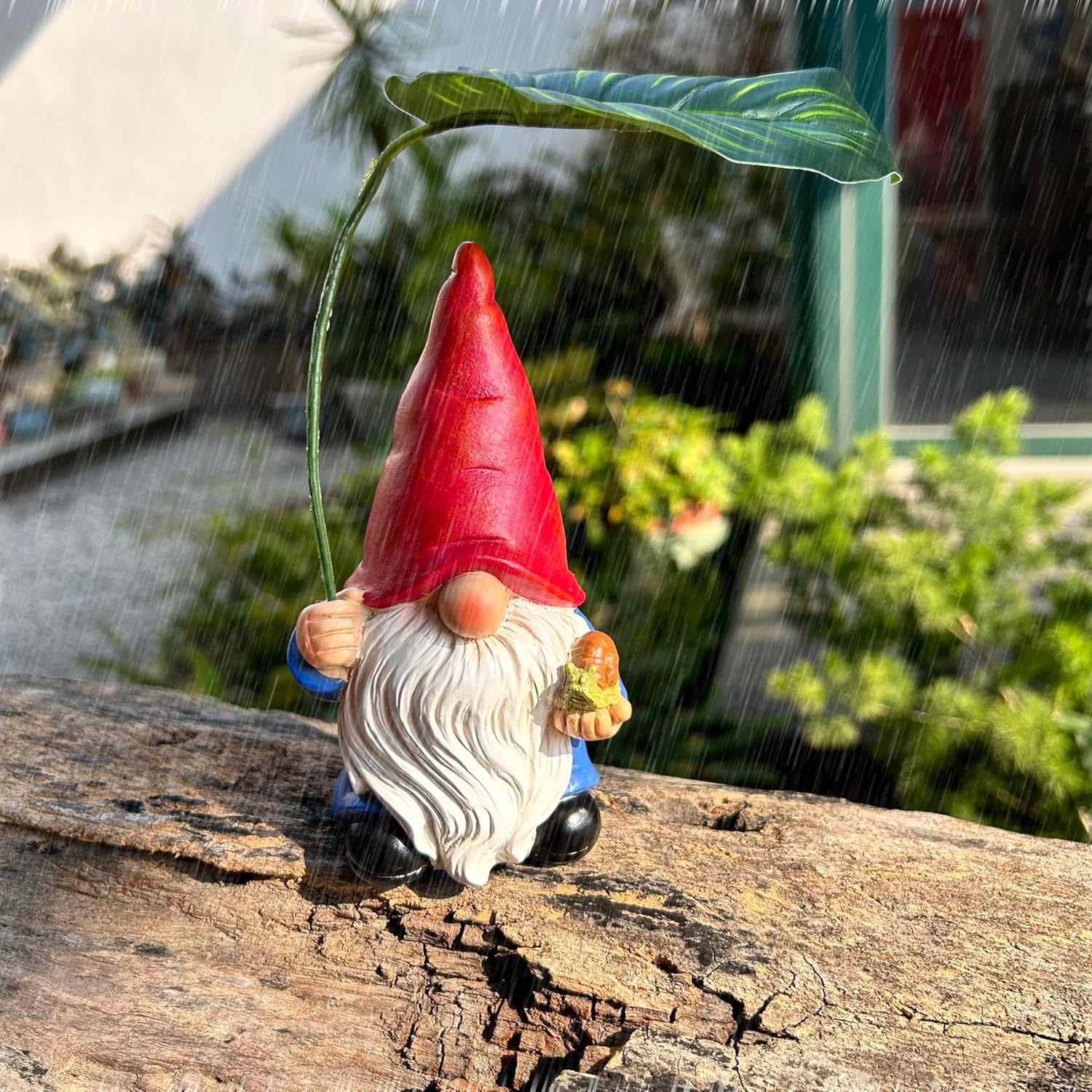 Demonstrates the product's ability to withstand outdoor elements, specifically rain, making it suitable for garden decoration in all weather conditions.