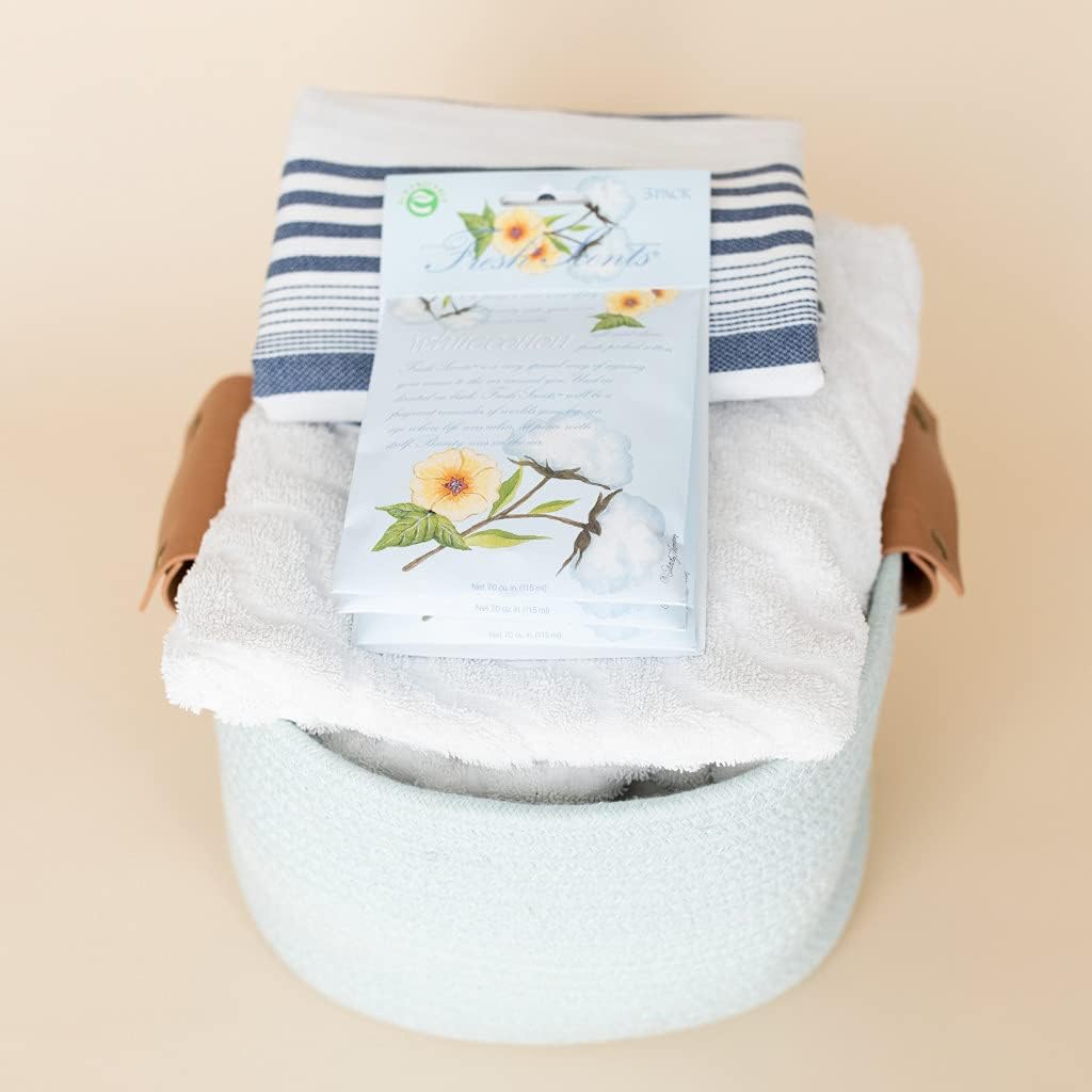 Shows the complete towel set package, including decorative box and floral packaging, to highlight the gift-ready nature of the product.