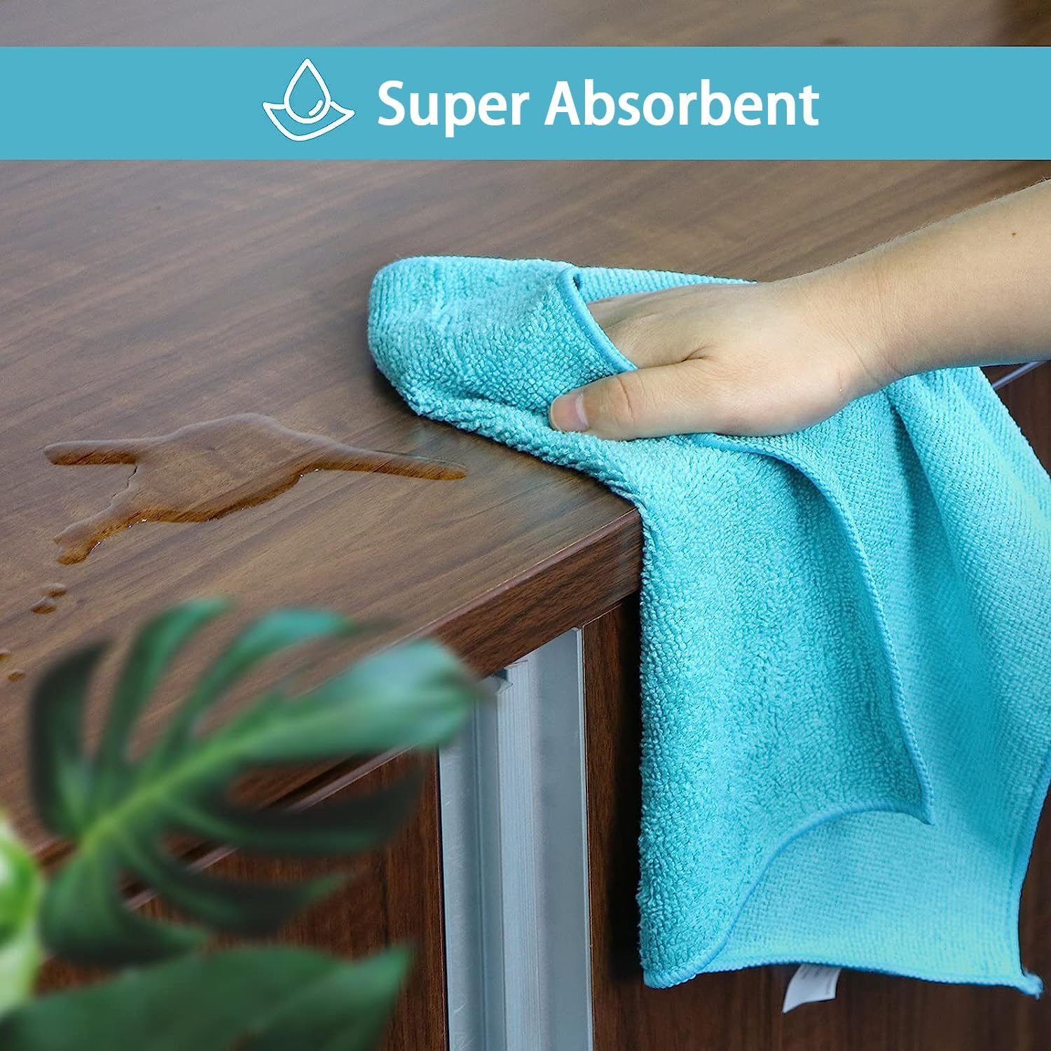 Demonstrates the product's high absorbency by showing it quickly soaking up a spill on a wooden surface.