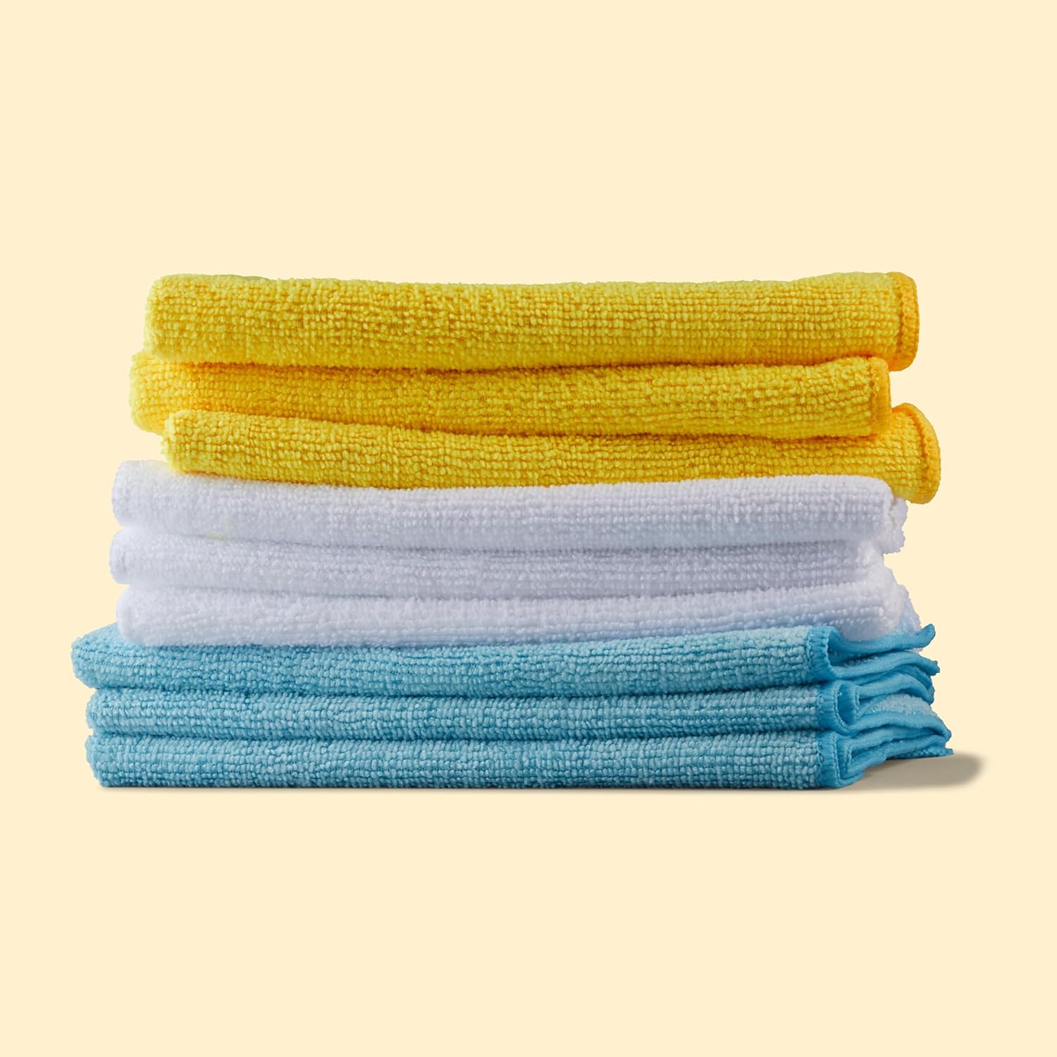 Shows the variety of microfiber cloths included in the product set, highlighting different colors available.
