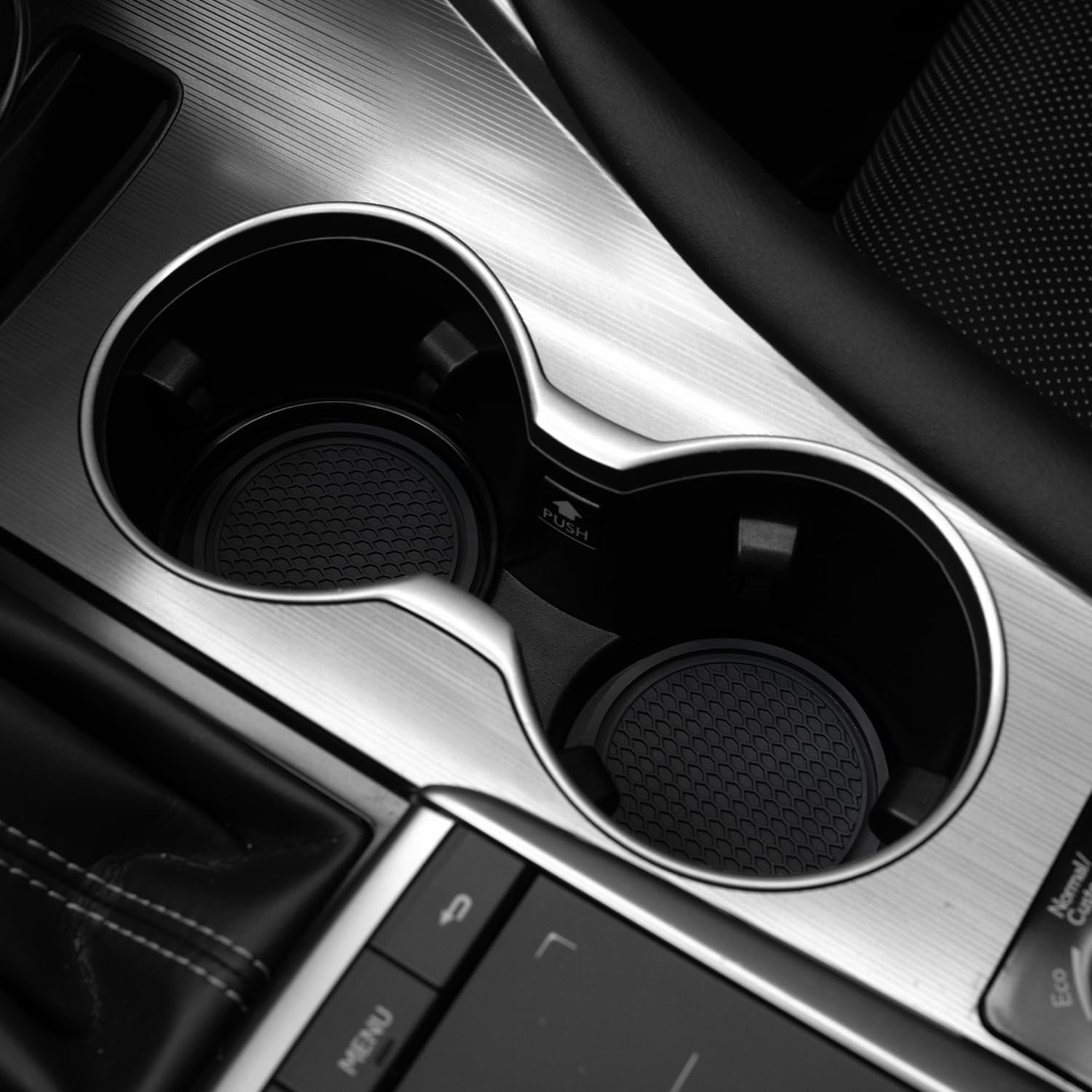 Highlights the high-quality, well-designed cup holders in the vehicle's interior to showcase attention to detail and convenience.