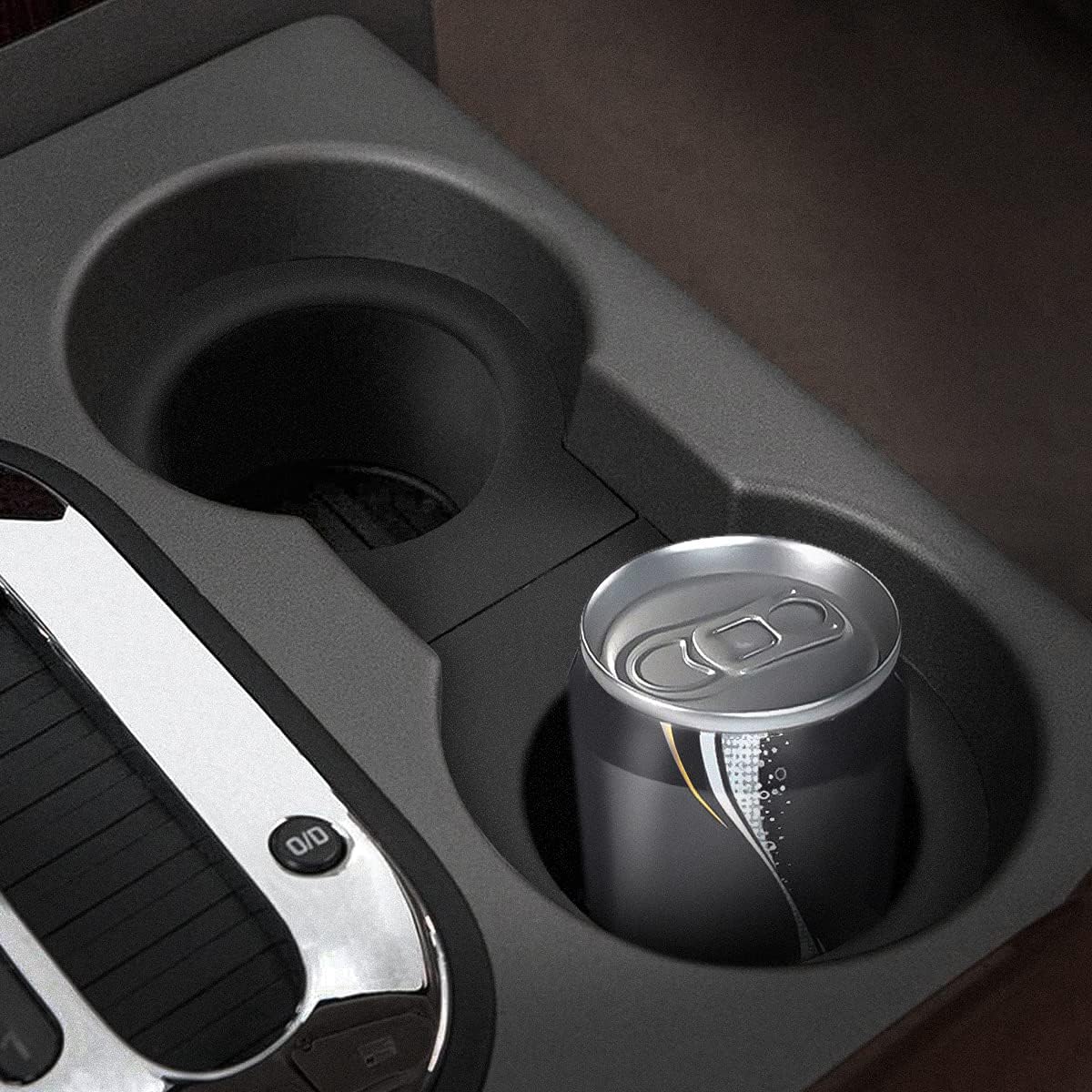 Highlights the product's cup holder feature, showing its ability to securely hold a beverage can.