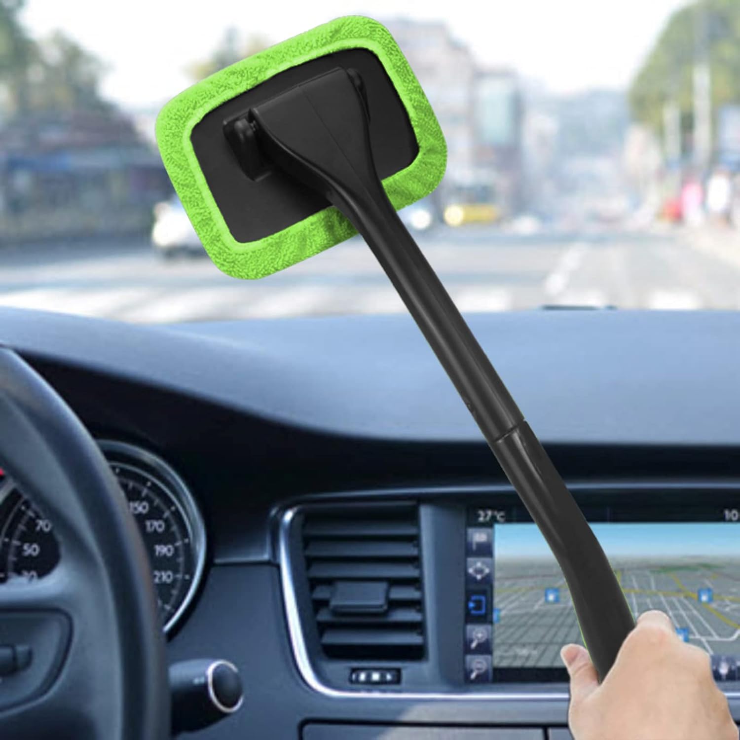 Demonstrates the product's ability to easily clean car windshields with its long handle and microfiber pad.