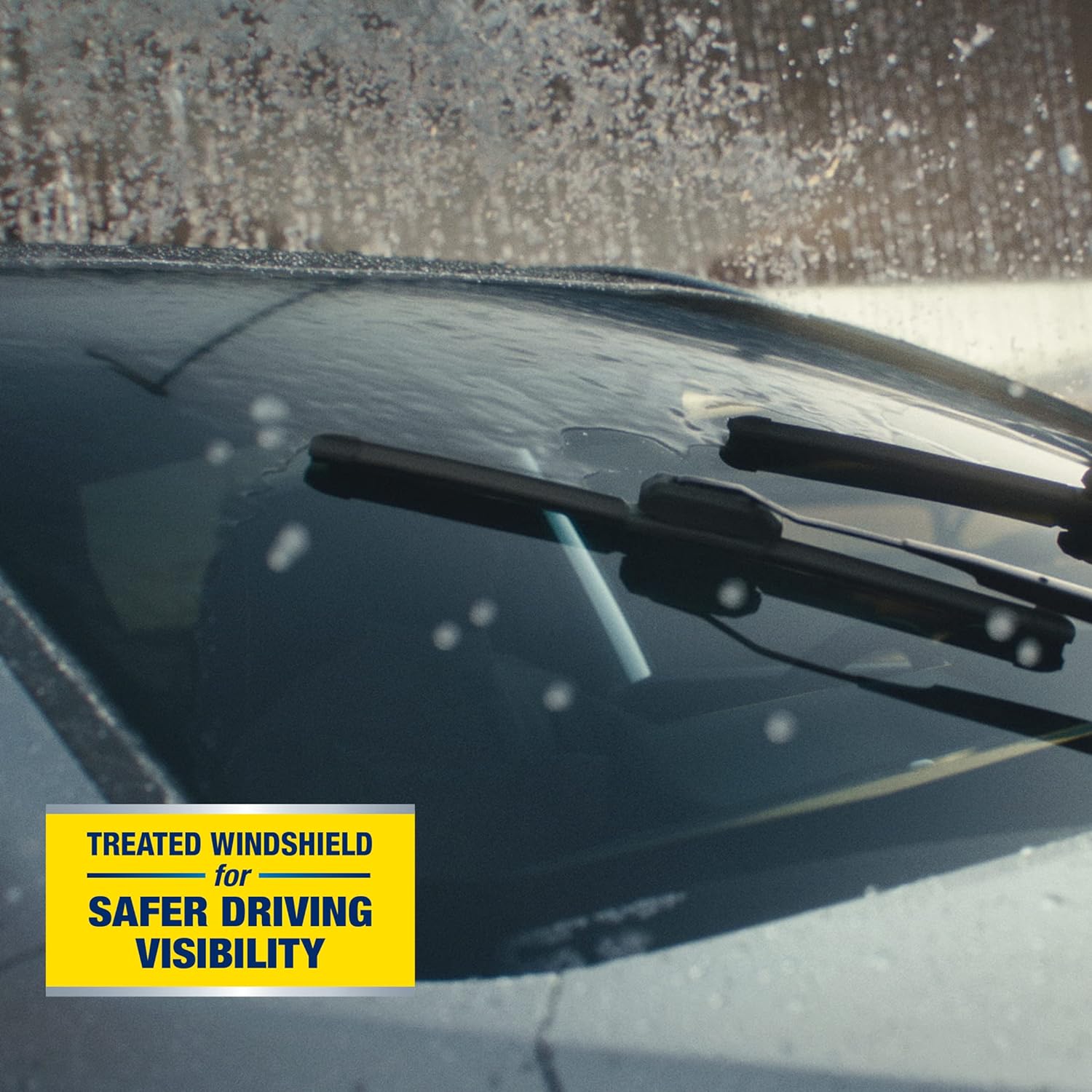 Highlights the safety benefit of a treated windshield that improves driving visibility in adverse conditions.