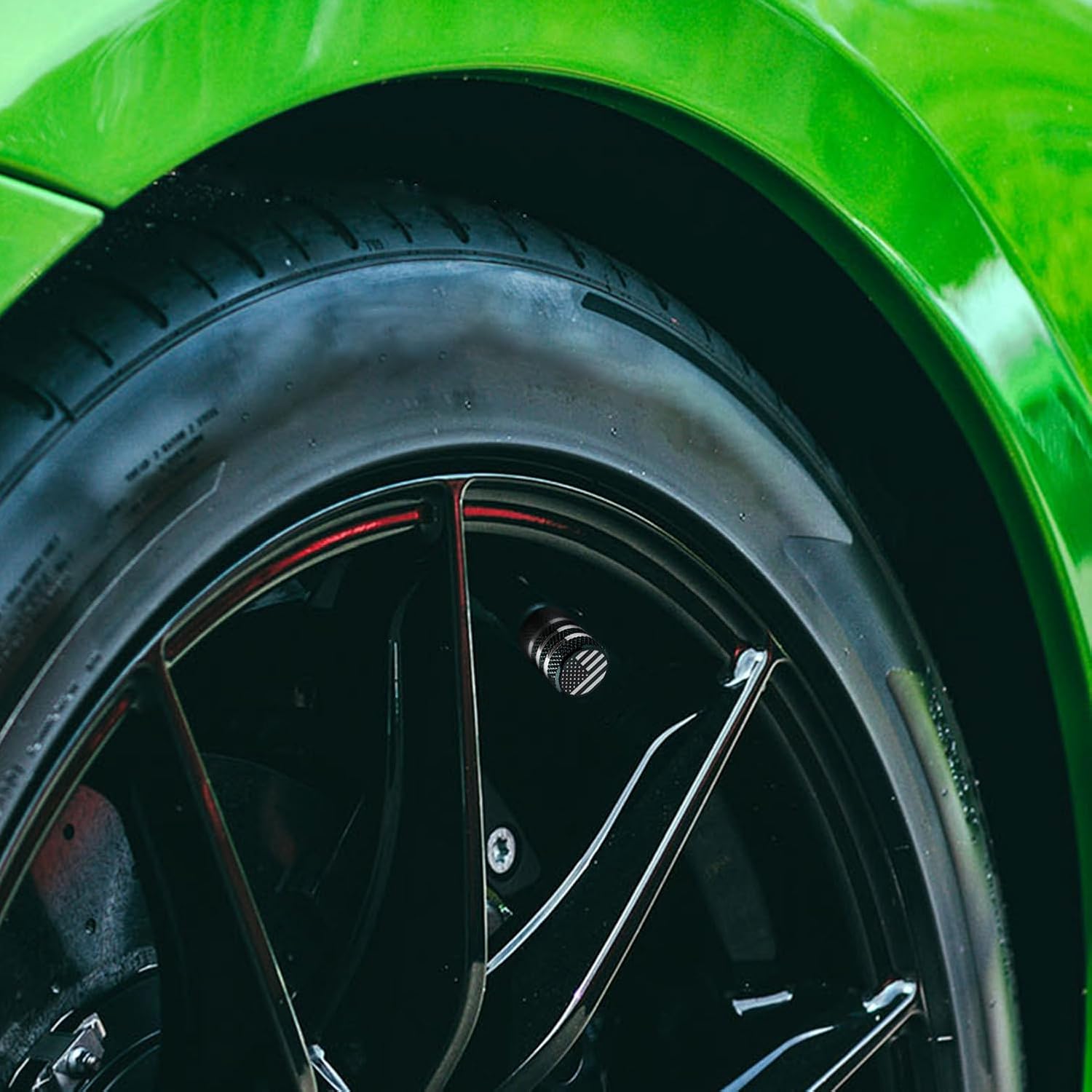 Highlights the high-quality, performance-oriented tires on the vehicle to emphasize its sporty nature and handling capabilities.