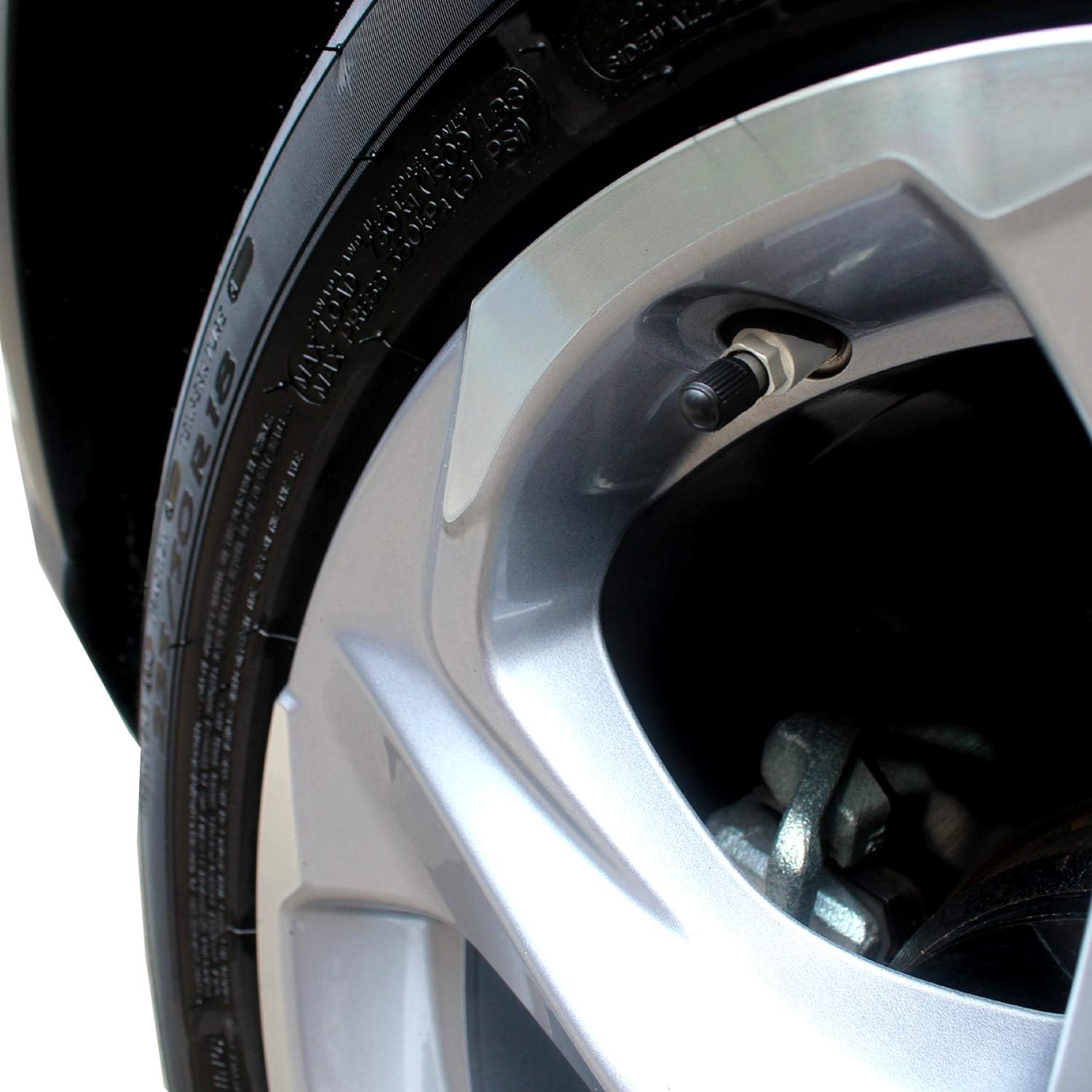 Highlights the presence of a tire pressure monitoring system, showing the valve stem sensor on the wheel rim to reassure customers about safety and maintenance features.