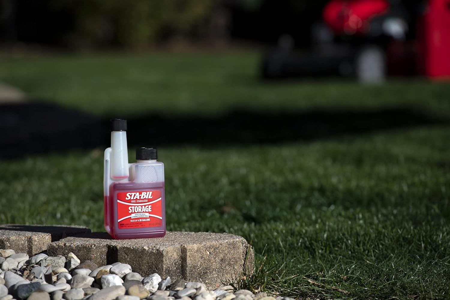 Shows the product being used in an outdoor setting, suggesting its suitability for lawn and garden equipment maintenance.