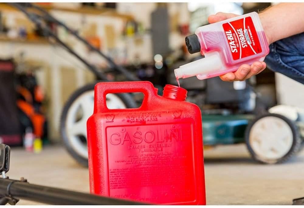 Demonstrates how to add fuel stabilizer to a gasoline container, educating users on proper storage and maintenance of fuel.