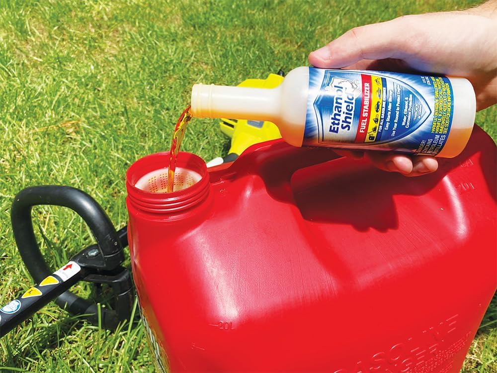 Demonstrates how to use the Ethan Shield fuel stabilizer product by pouring it into a gas can, educating customers on proper application.