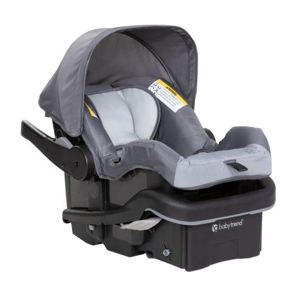 Highlights the safety features of the car seat, including the secure base and protective canopy, to reassure parents about their child's safety during travel.