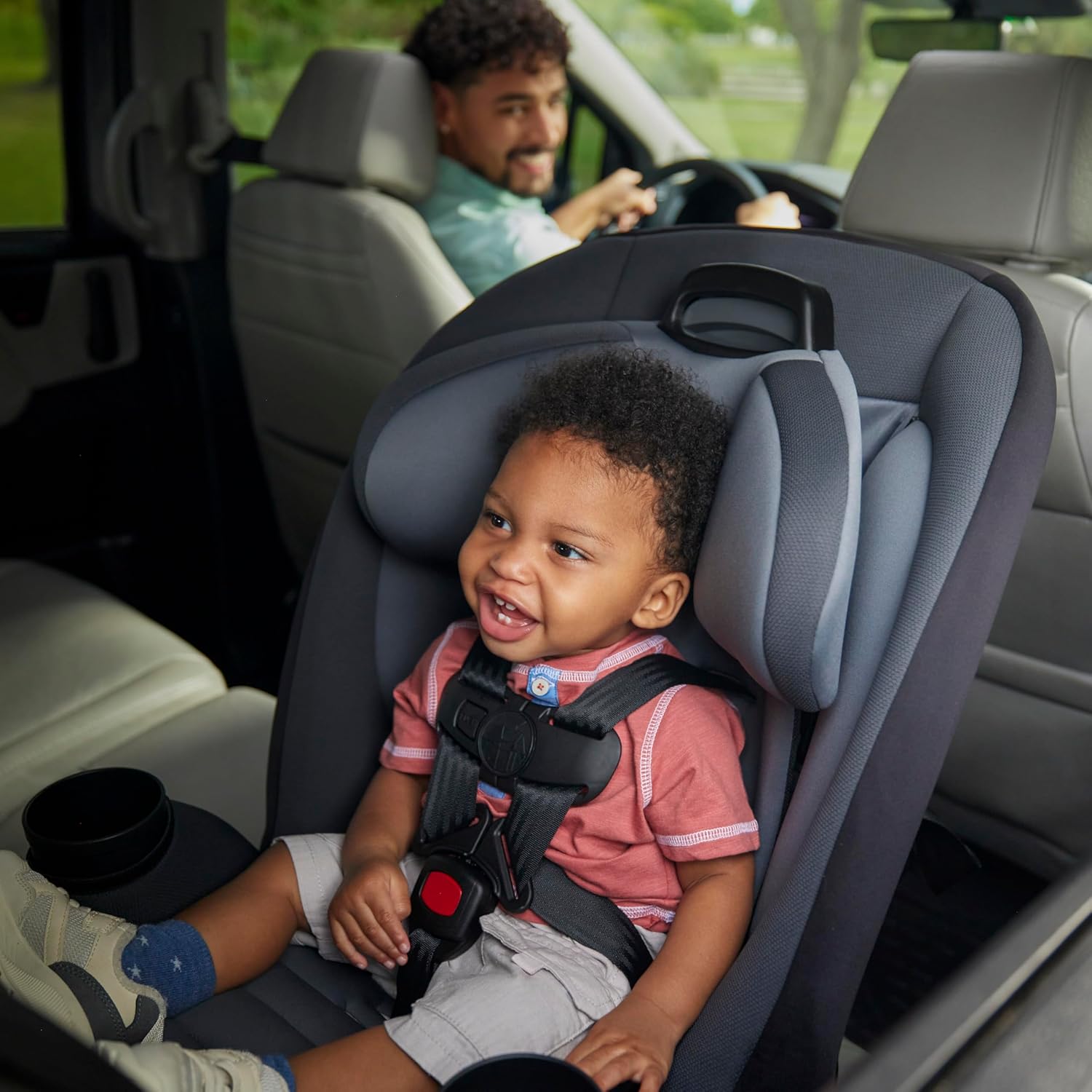 Shows the product in use during a family car trip, emphasizing child safety and ease of use for parents.