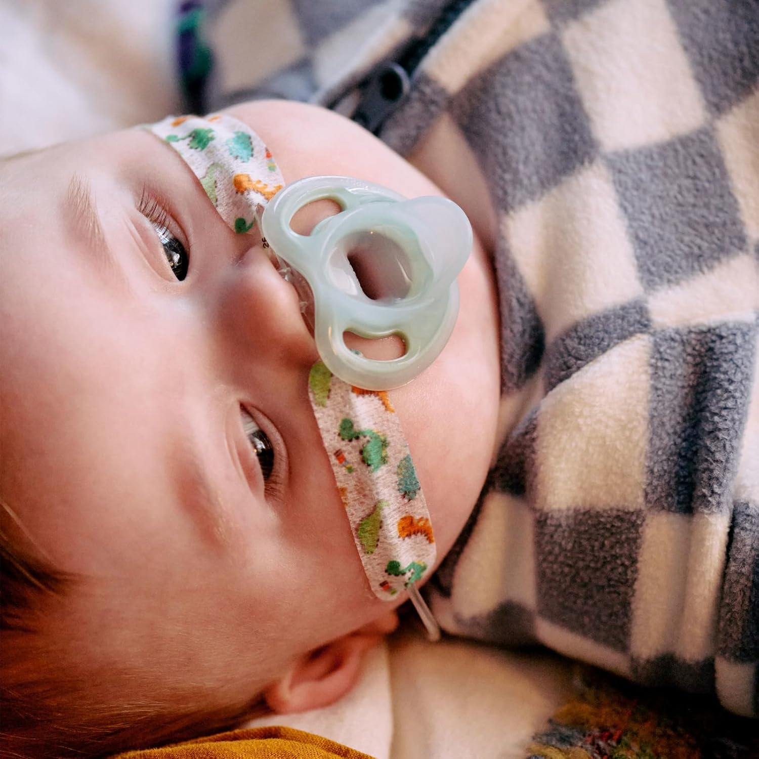 Shows the product in use by a real baby, demonstrating its comfort and suitability for infants.