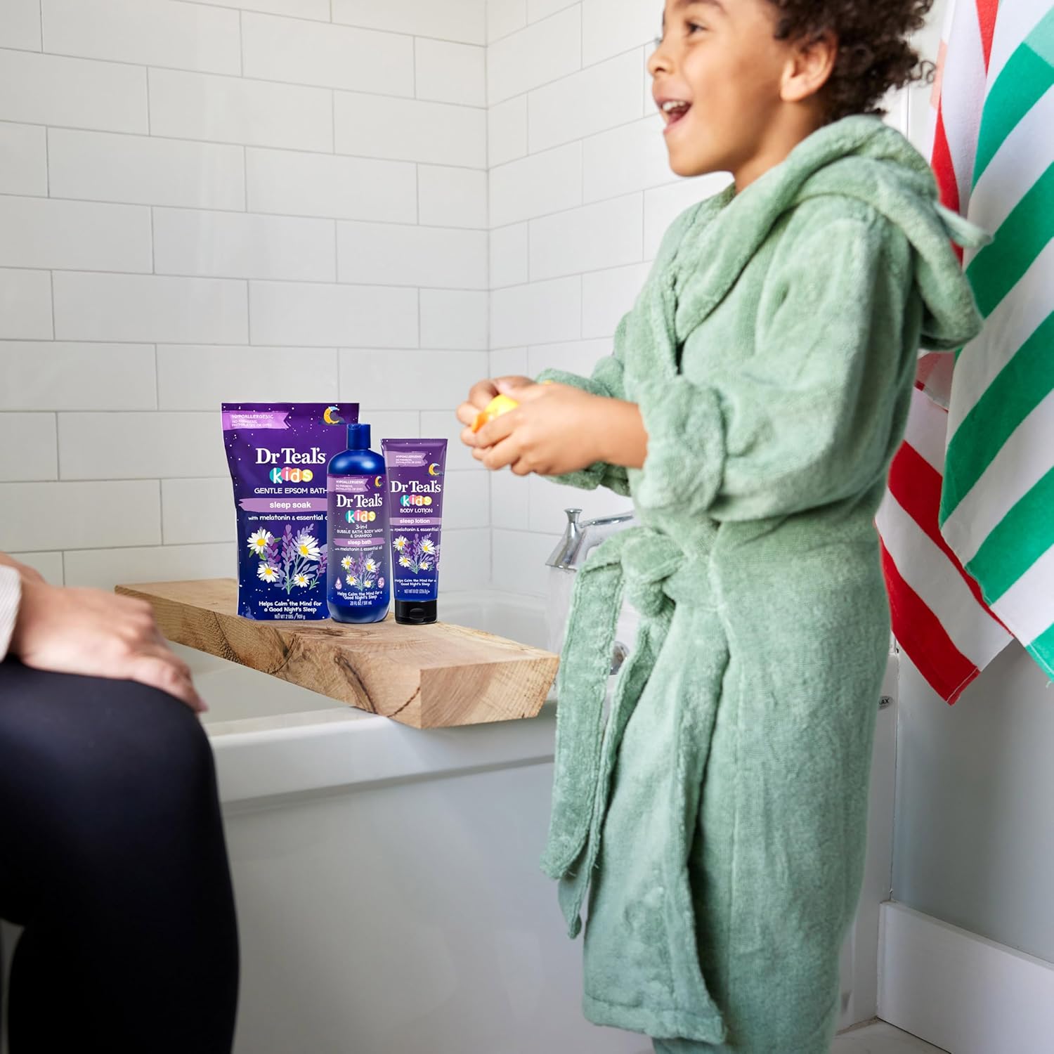 Shows the product in a real-life bath time setting to demonstrate its use and appeal to children.