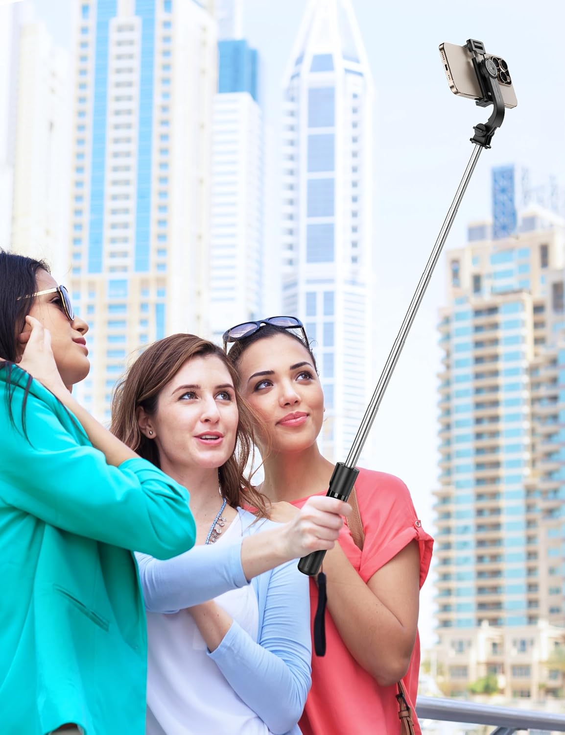 Demonstrates how the selfie stick can be used for capturing group photos and travel memories in scenic locations. Shows the product being used in a real-world context, emphasizing its suitability…