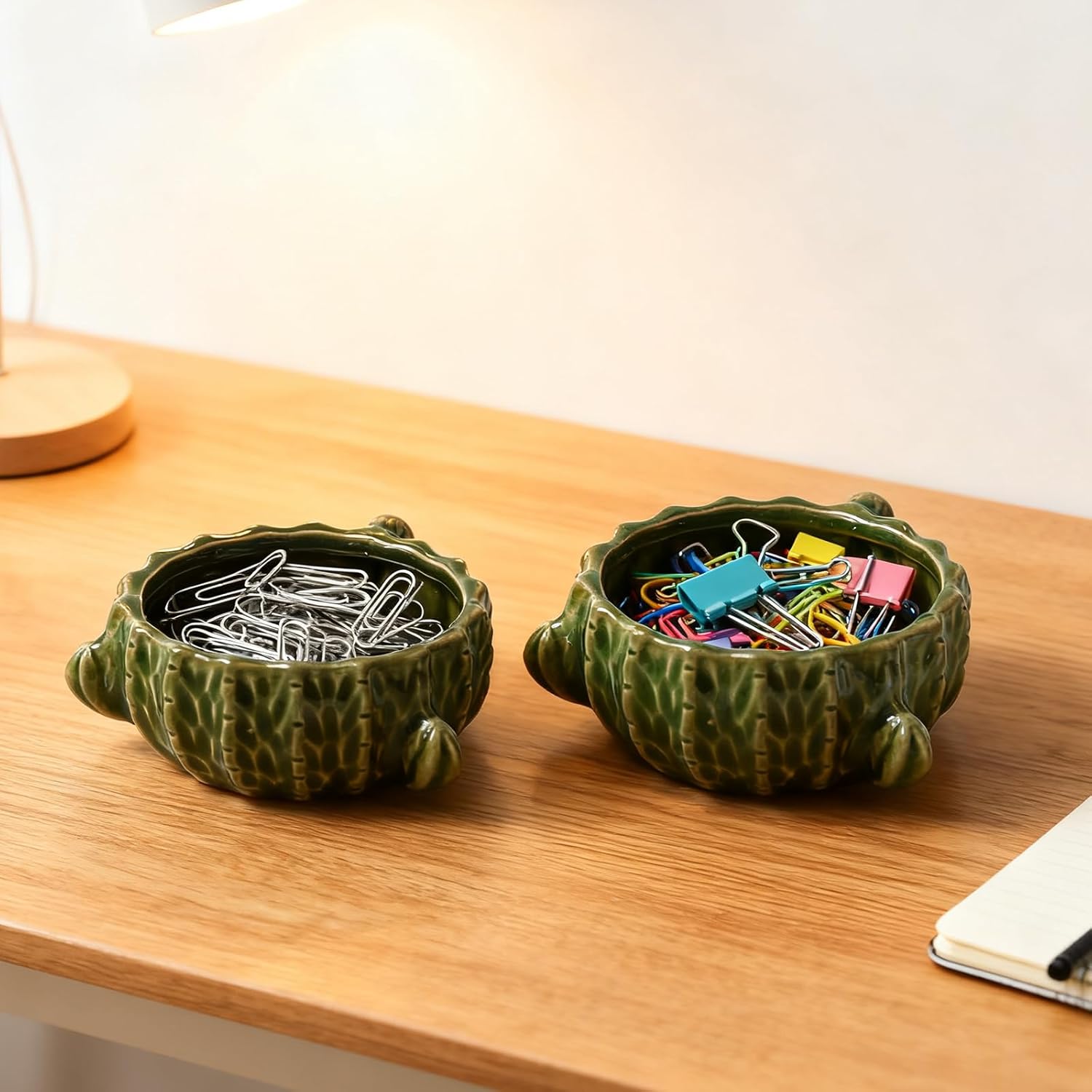 Shows how the product can be used to organize different types of office supplies like paperclips and binder clips. Demonstrates how the product can be used in a desk setting to keep small office…