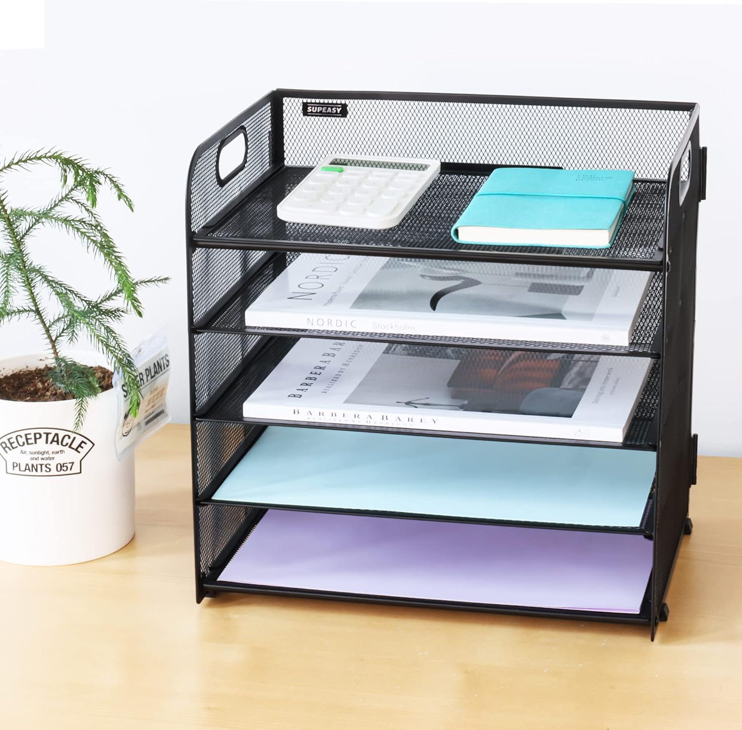Shows the product's capacity to organize and store various documents and office supplies, demonstrating its utility for desk organization.