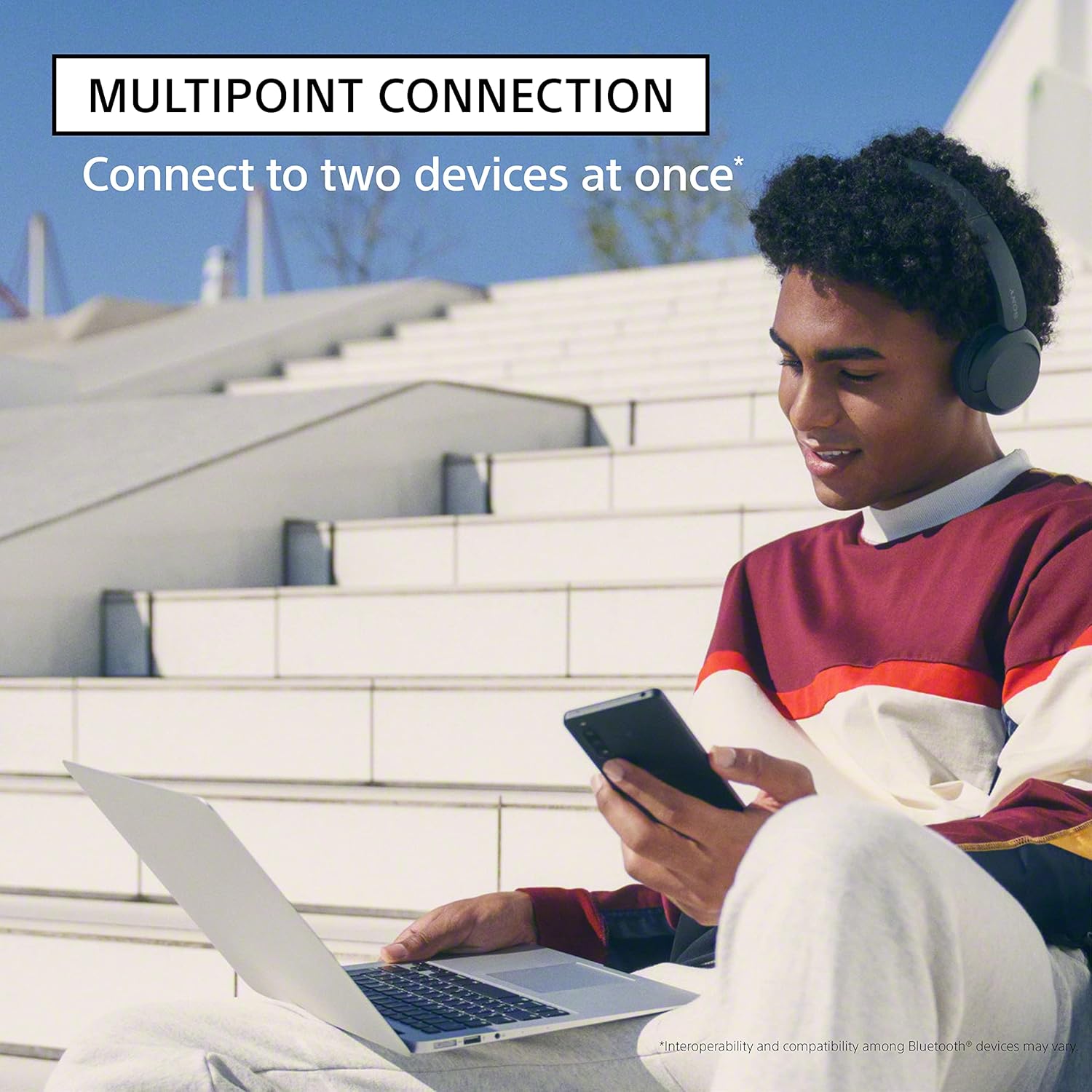Highlights the headphones' ability to connect to two devices simultaneously, emphasizing convenience and versatility for users.