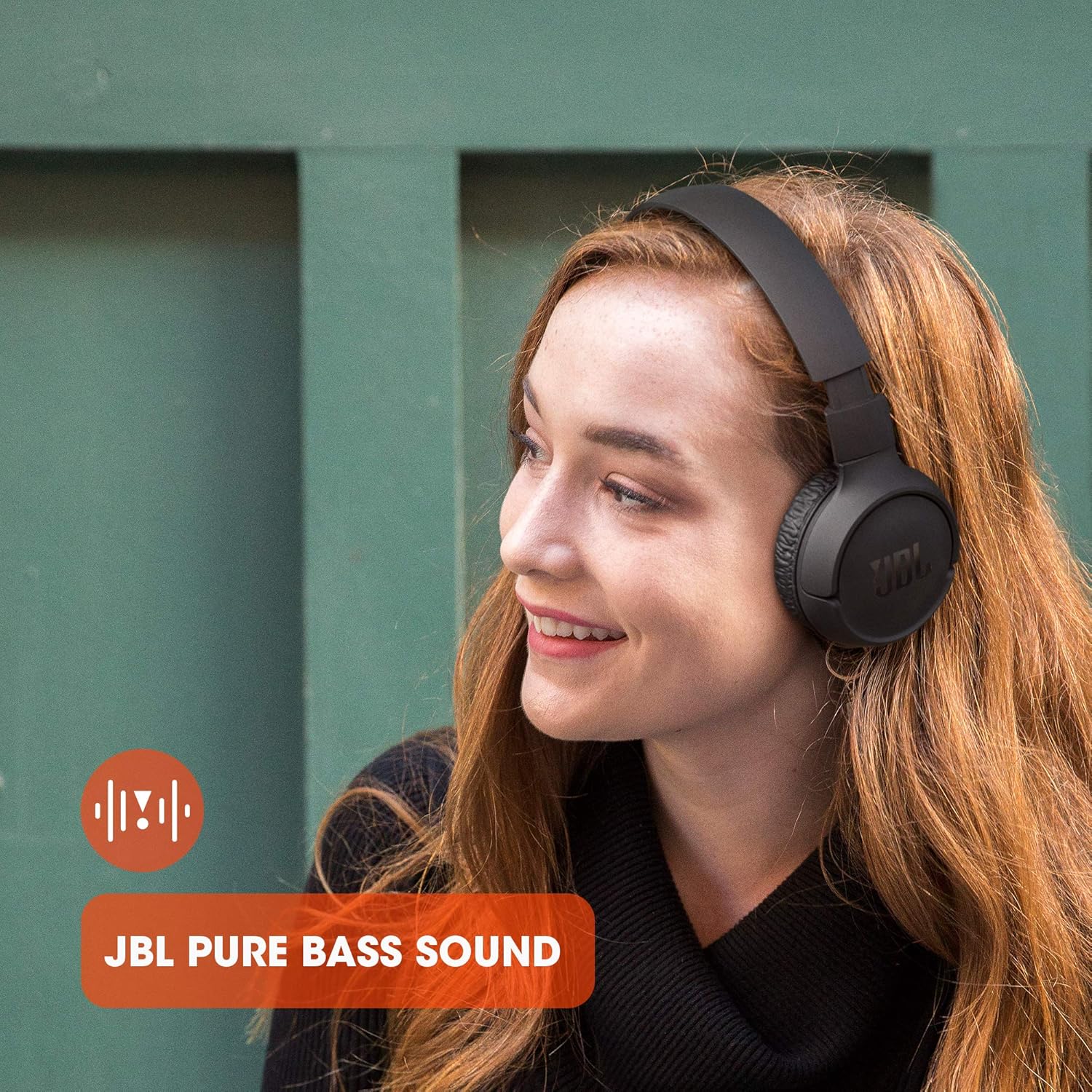 Highlights the high-quality bass sound feature of the JBL headphones to appeal to audio enthusiasts. Shows the product in use by a happy user, emphasizing its suitability for everyday listening…