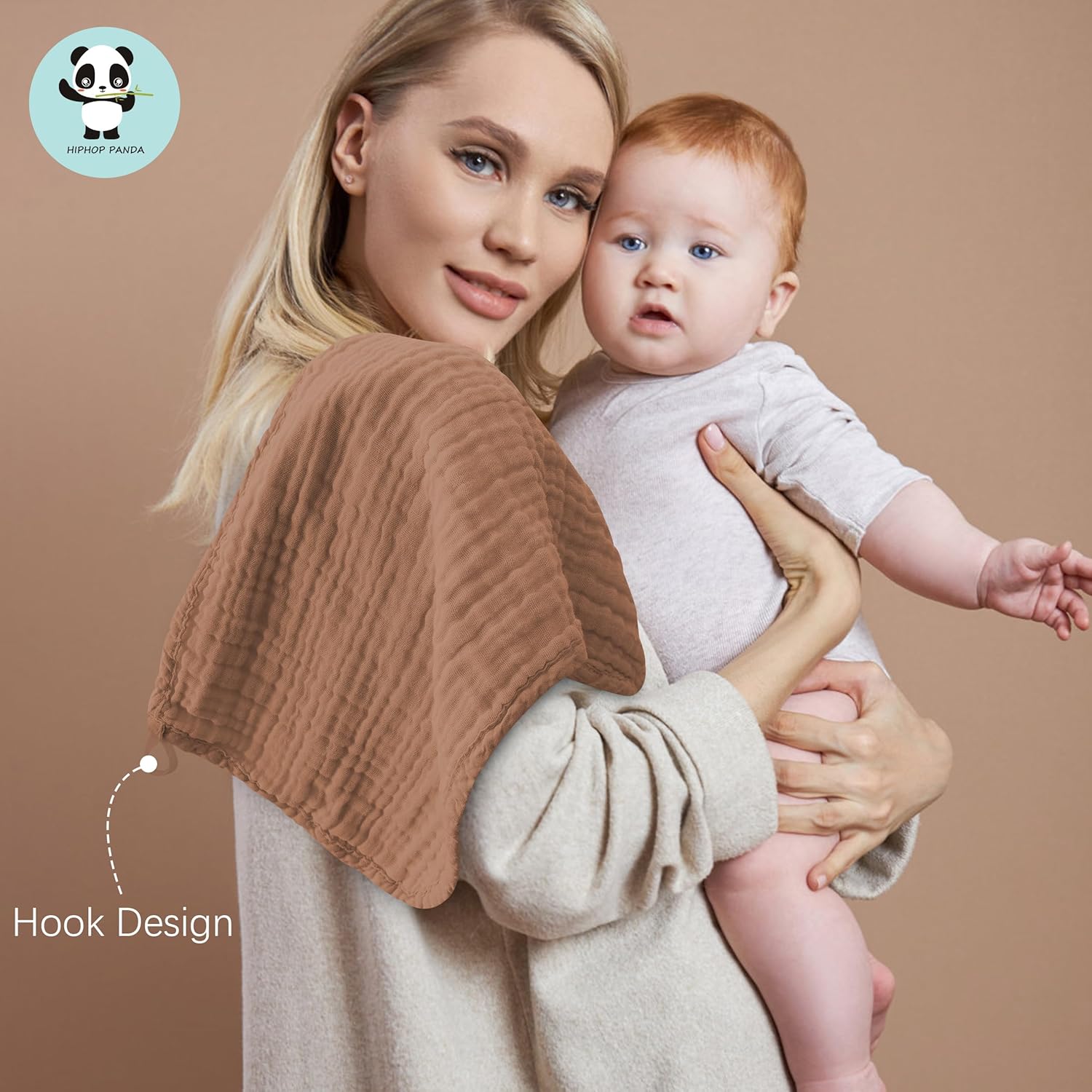 Highlights the product's hook design feature, likely for easy attachment or hanging of the cloth while caring for a baby.