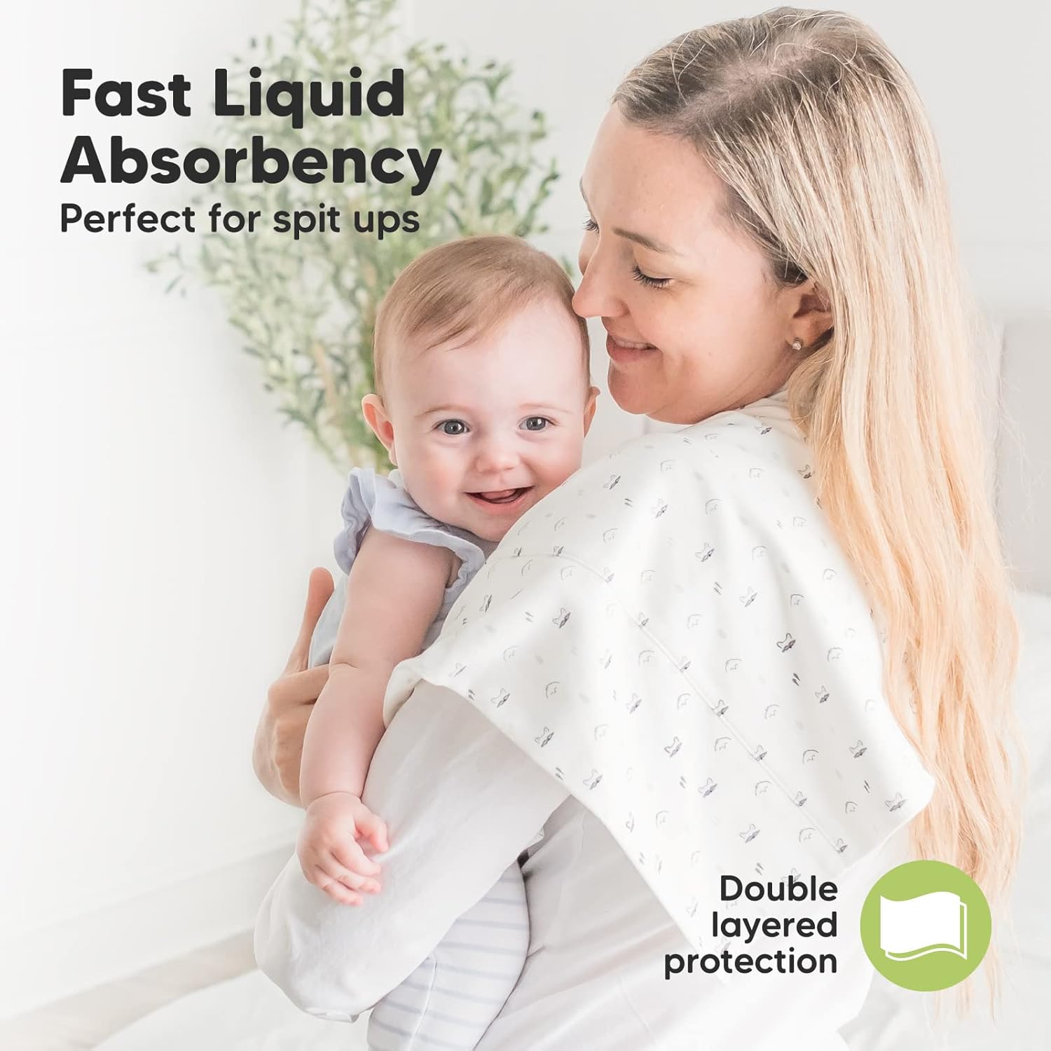 Highlights the product's ability to quickly absorb liquids, specifically for handling baby spit-ups, reassuring parents of its effectiveness.