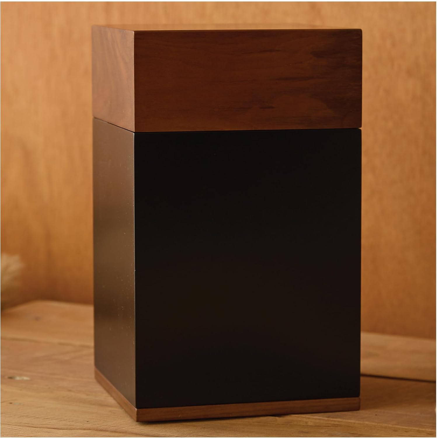 Showcases the product's high-end, minimalist aesthetic with contrasting wood tones to appeal to design-conscious consumers.