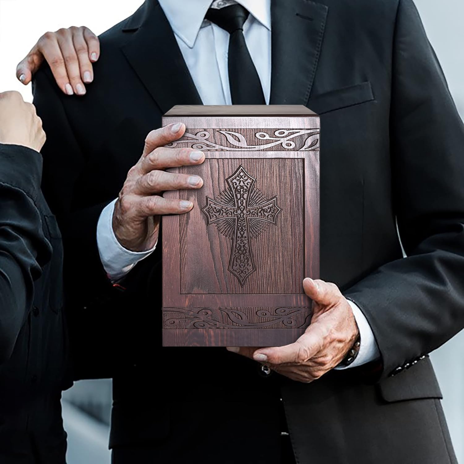 Showcases the ornate design and craftsmanship of the wooden urn product, emphasizing its religious symbolism and aesthetic appeal.