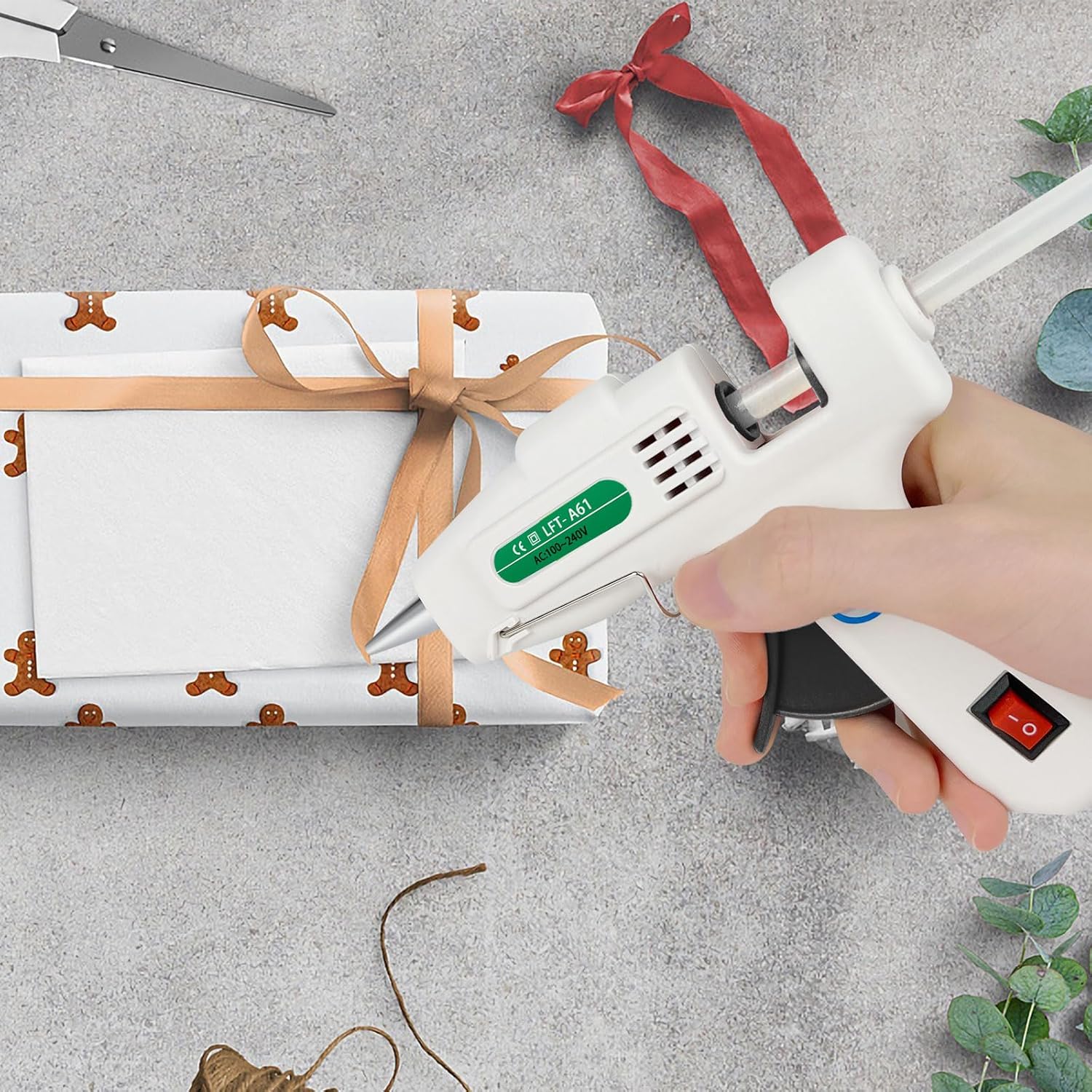 Shows the product being used for holiday gift wrapping, emphasizing its usefulness during seasonal gift-giving occasions. Demonstrates how to use the glue gun for gift wrapping, providing a…