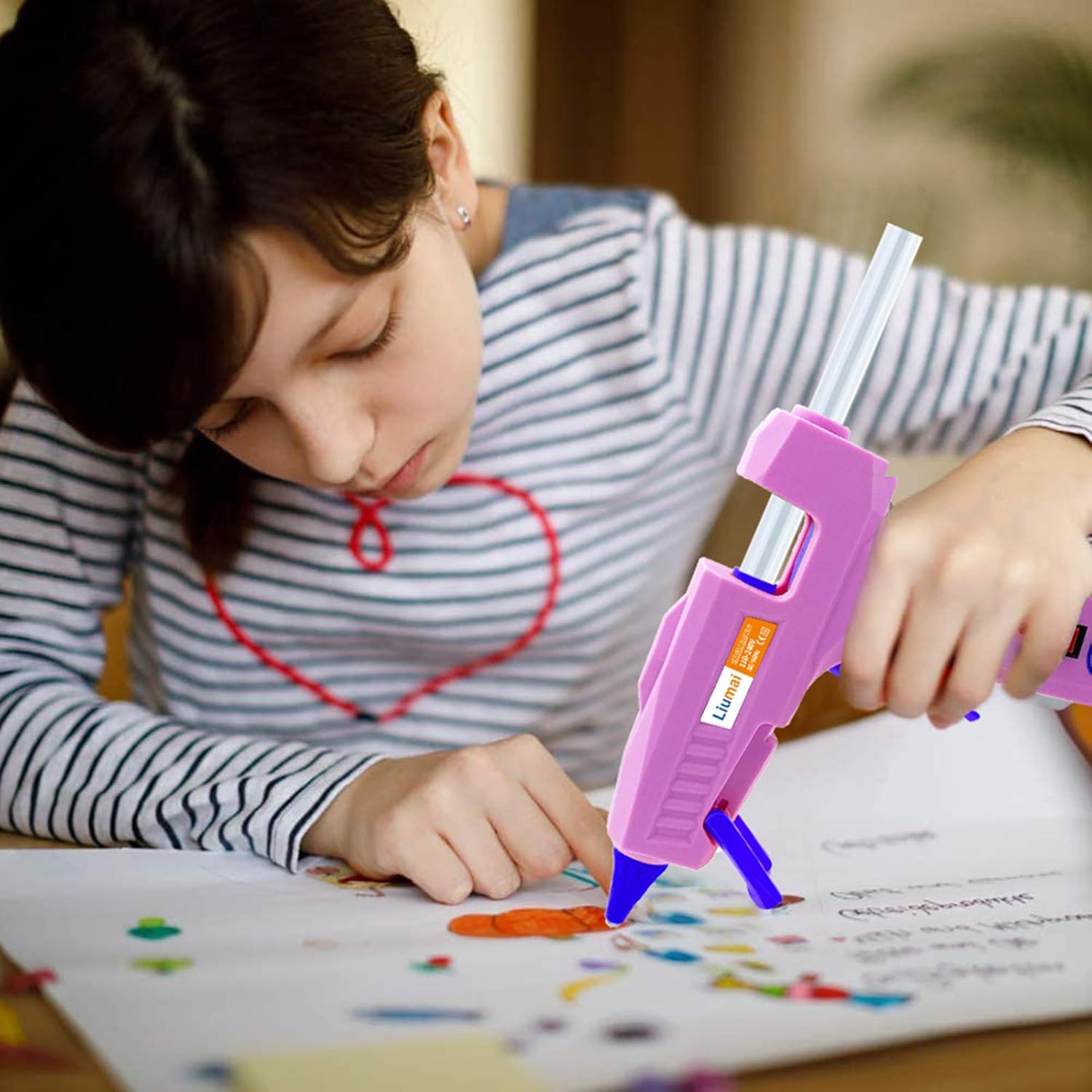 Shows the product being used by a child for crafting, demonstrating its suitability for creative activities.