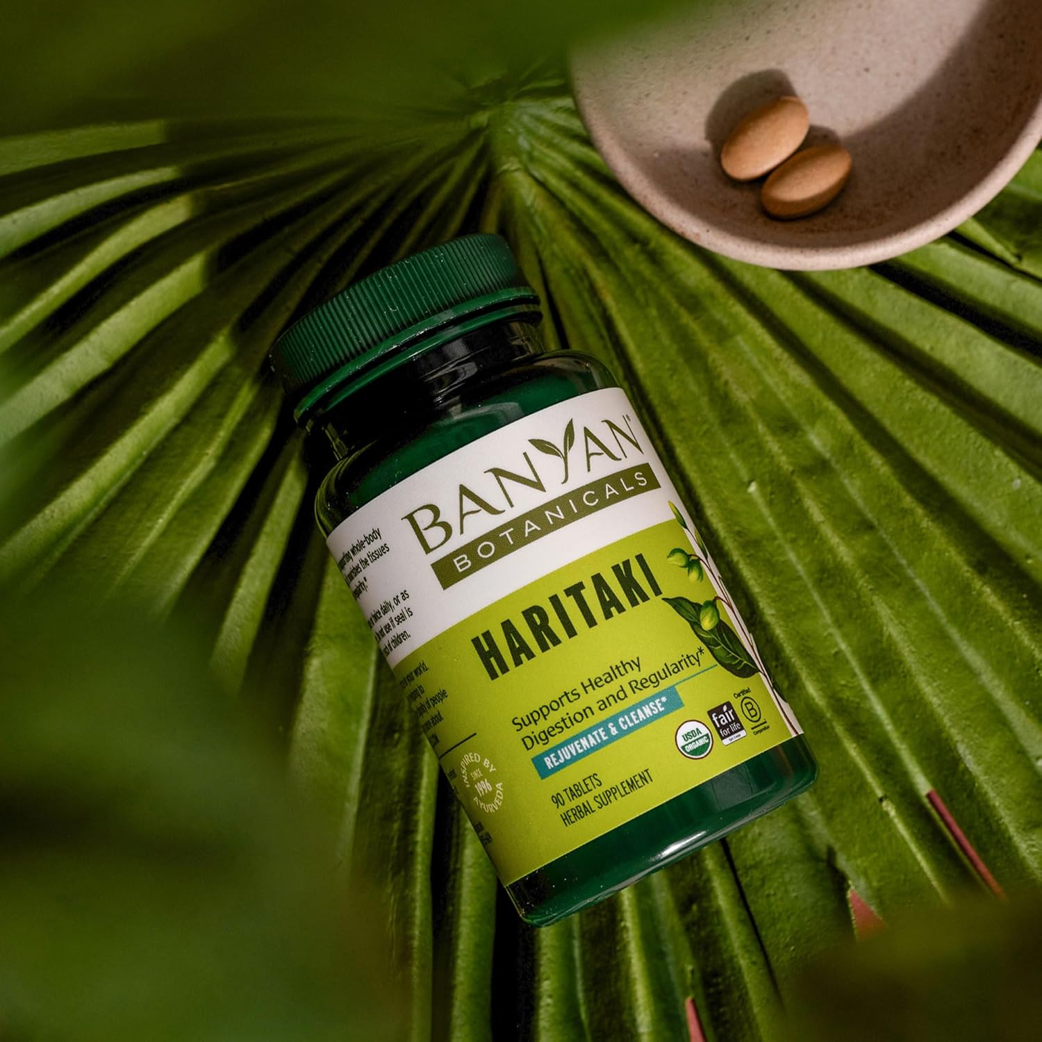 Shows the product in a natural, botanical environment to reinforce its organic and natural qualities. Highlights the product's main benefit of supporting healthy digestion and regularity.