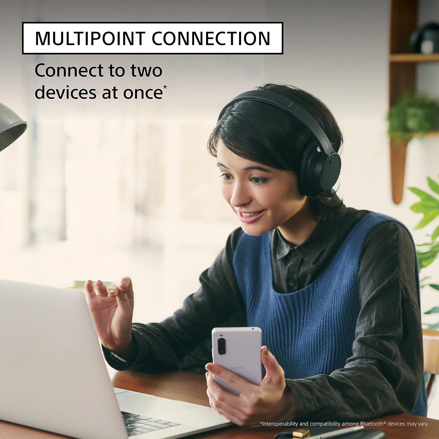 Highlights the headphones' ability to connect to two devices simultaneously, emphasizing convenience for multitasking users.