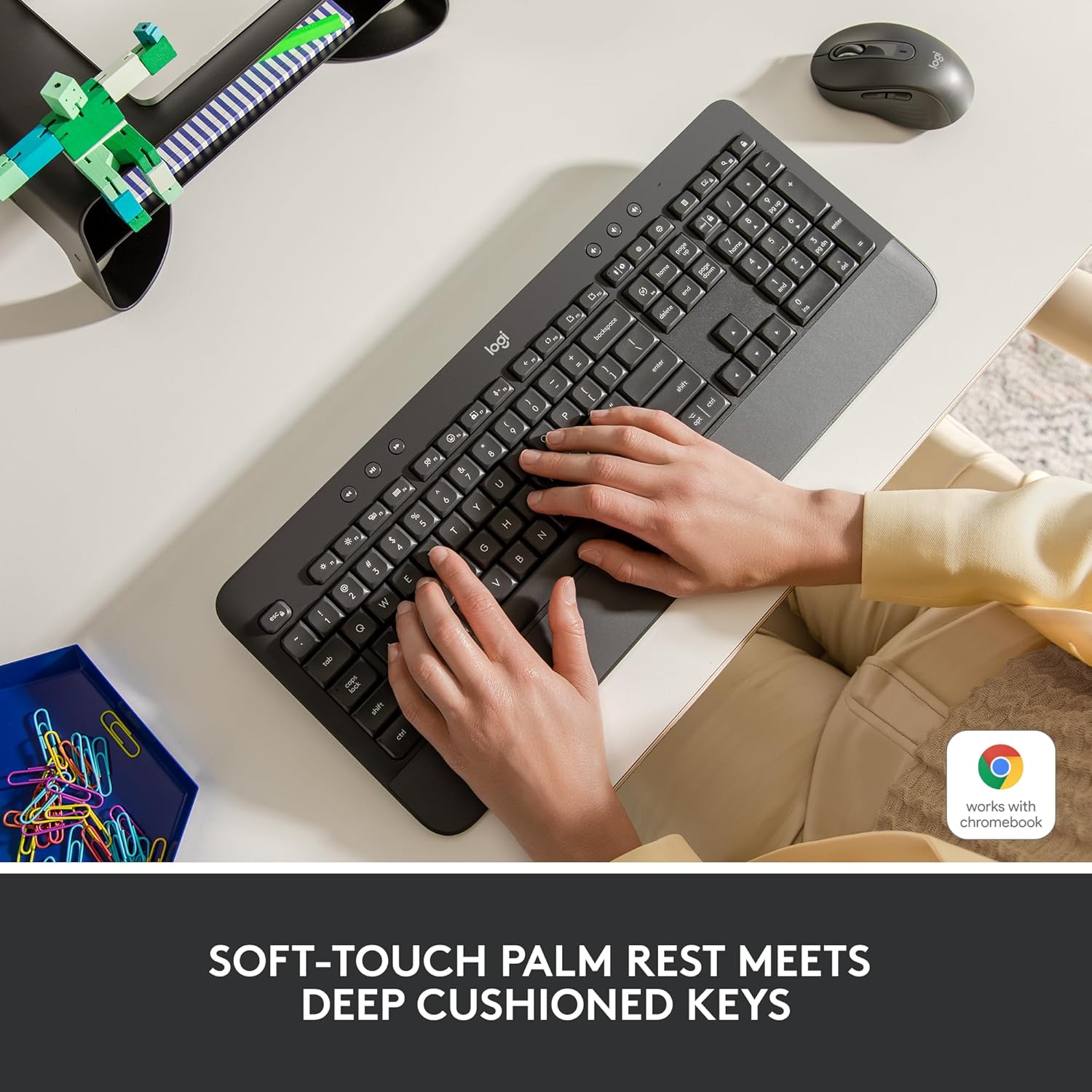 Highlights the keyboard's comfortable design with soft-touch palm rest and deep cushioned keys for improved typing experience.