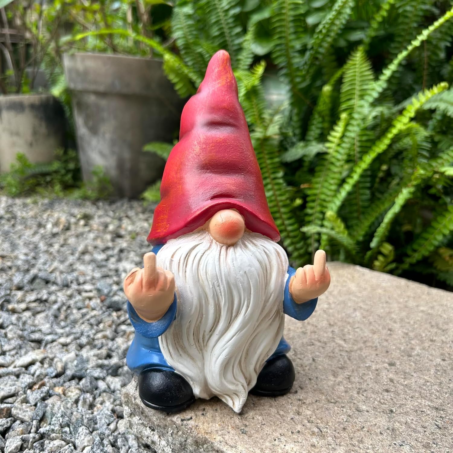 Shows the product in a natural garden setting to demonstrate its use as outdoor decor.