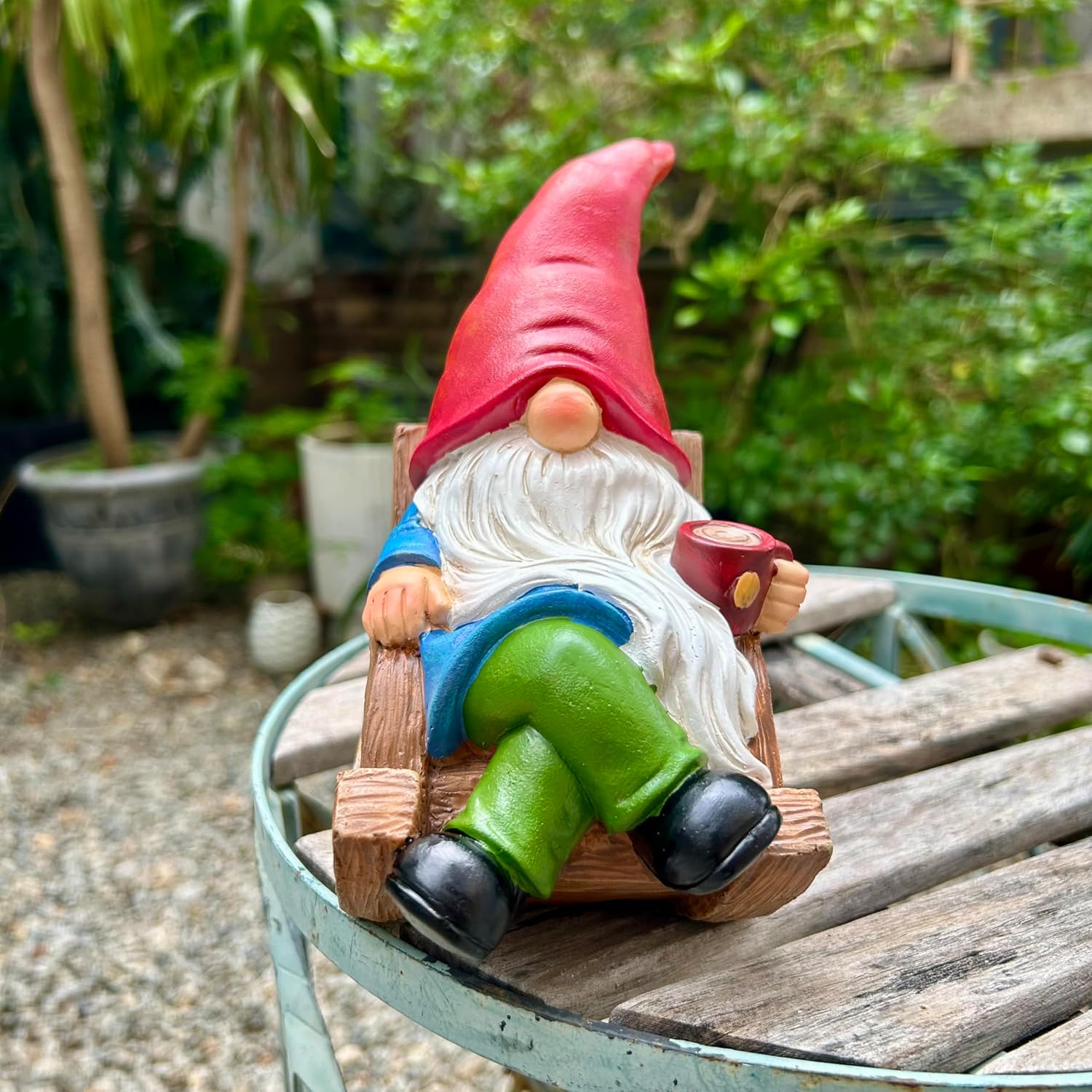 Shows the product in a natural outdoor setting to demonstrate its use as garden decoration.