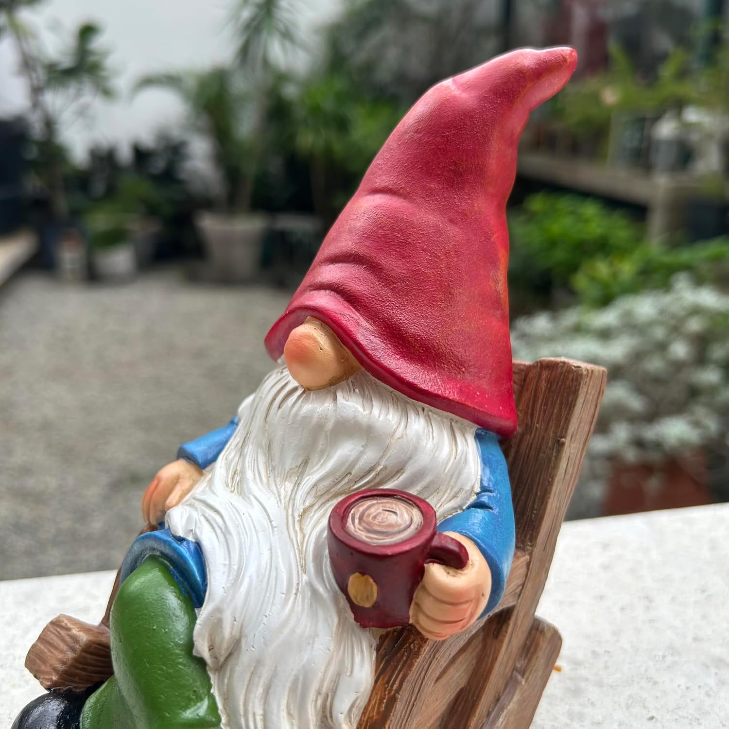 Shows the product in a natural outdoor setting to highlight its use as a garden decoration.