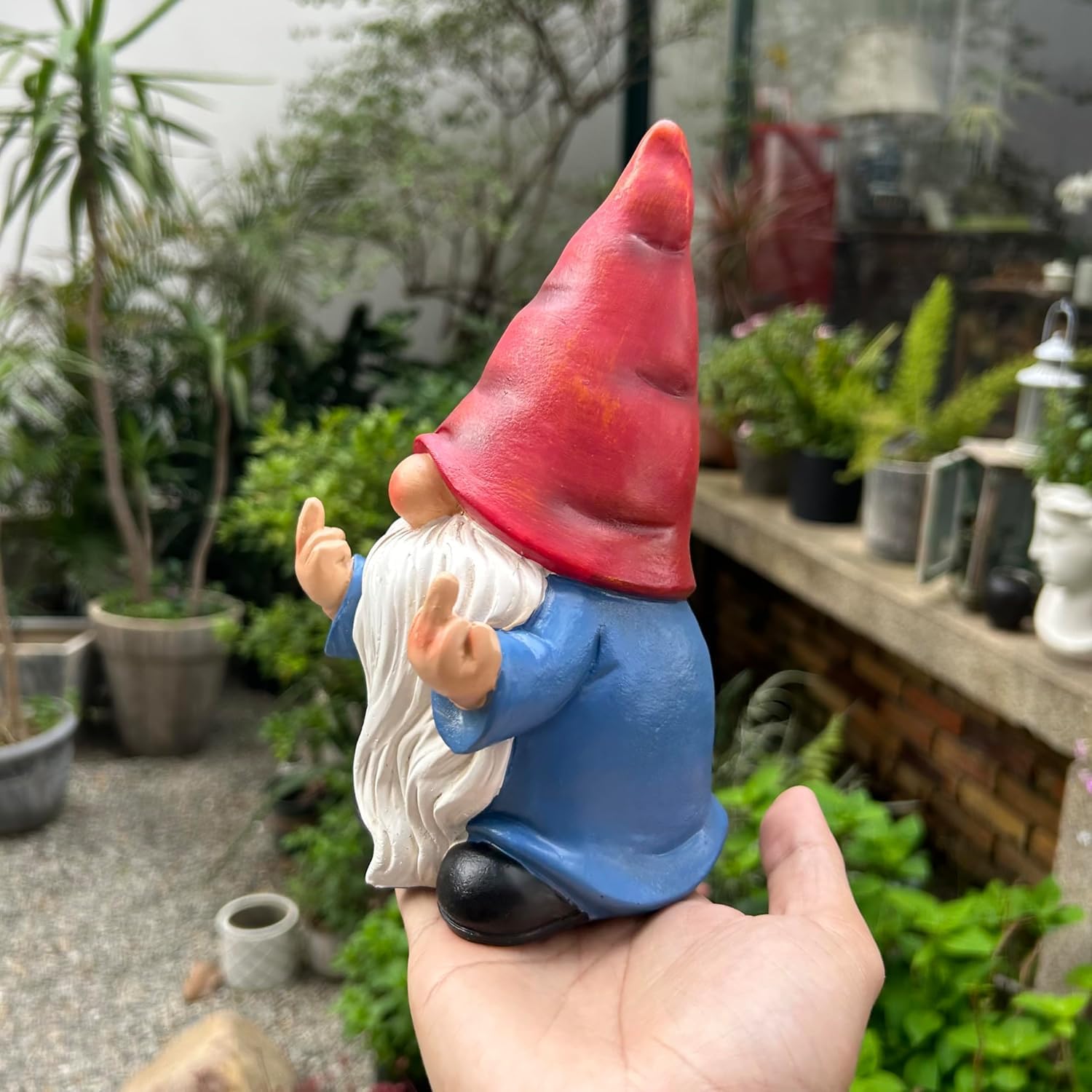 Shows the product in a real-world garden setting to demonstrate its decorative use and appeal.