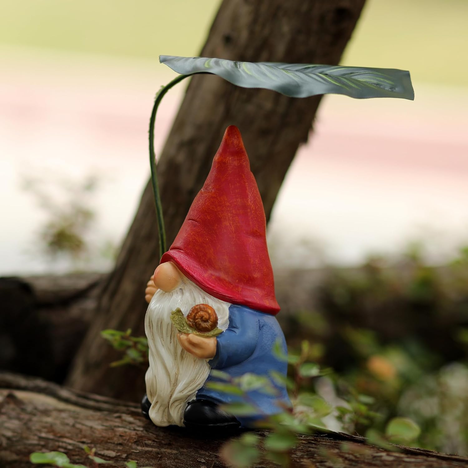 Shows the product in a natural outdoor setting to highlight its use as a decorative garden ornament.