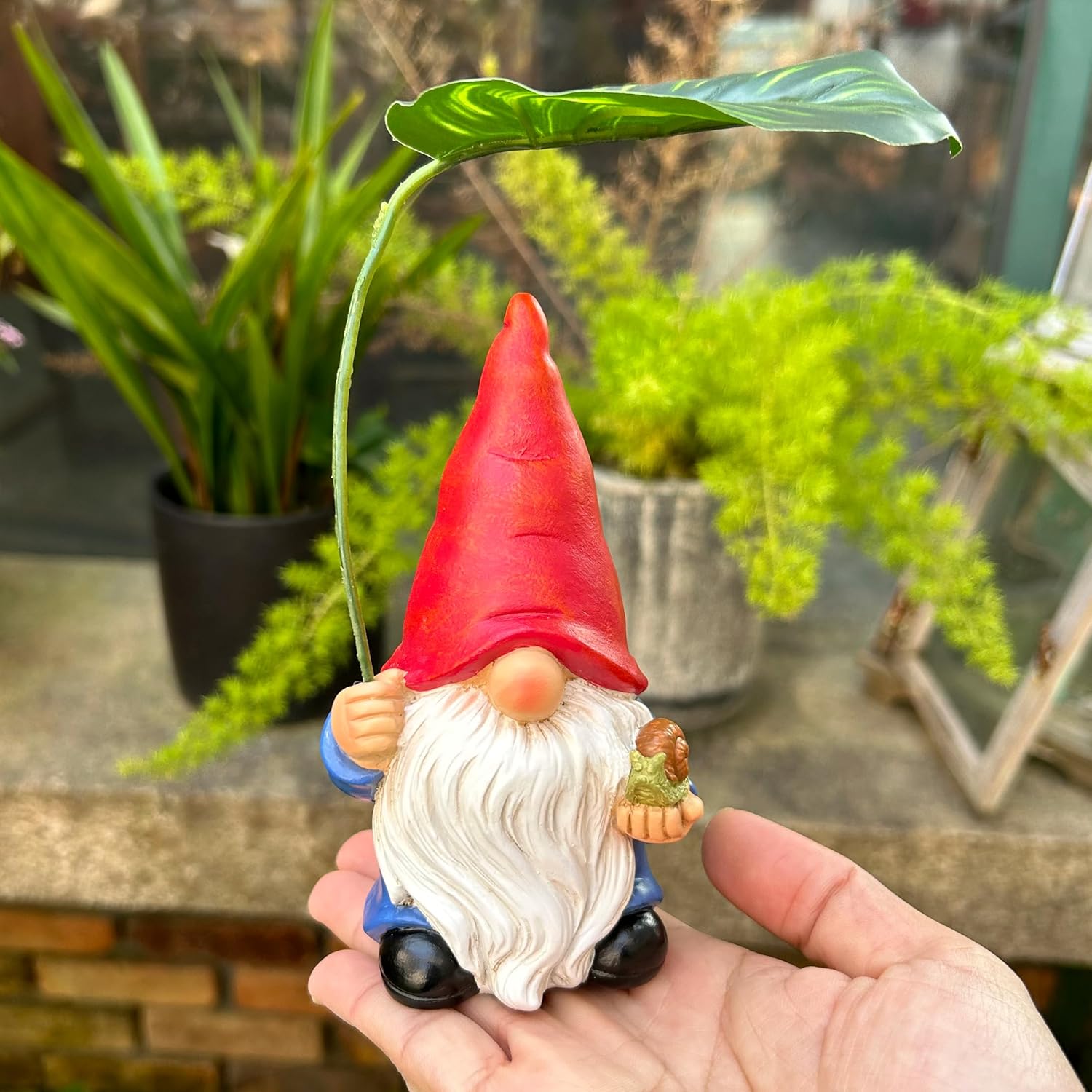 Shows the product in a real-world garden setting to demonstrate how it can be used as decorative outdoor decor.